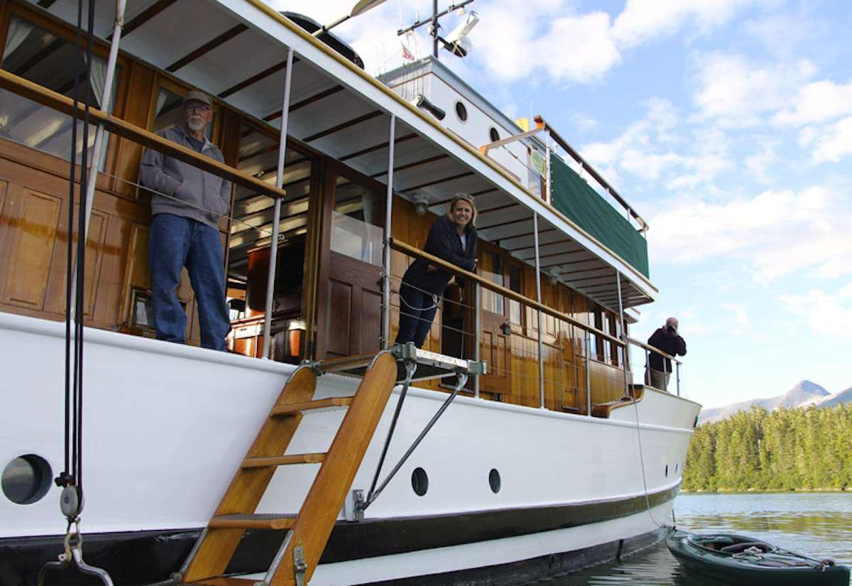 a person standing on a boat aboard DISCOVERY Yacht for Charter