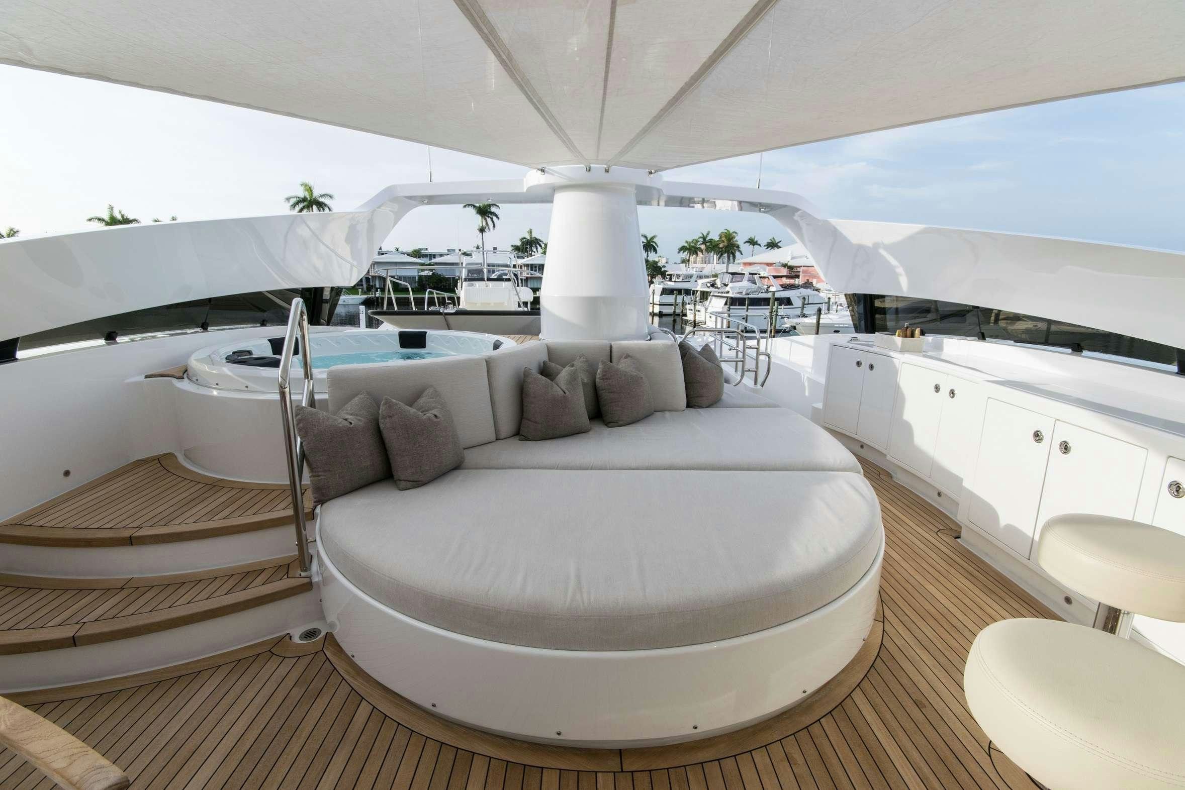 a large white bed in a room aboard INVICTUS Yacht for Charter