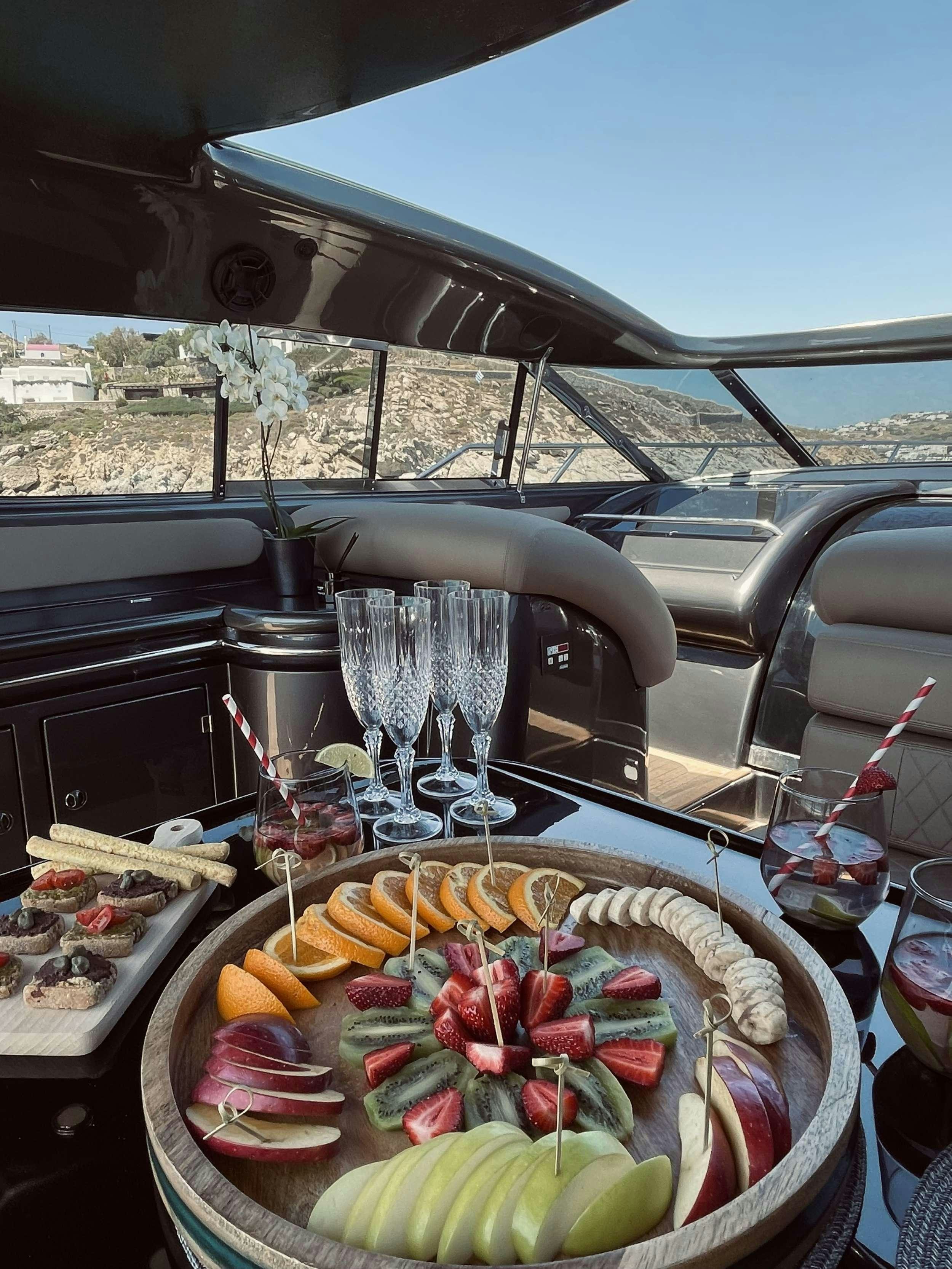 a table with food on it aboard 007 Yacht for Charter