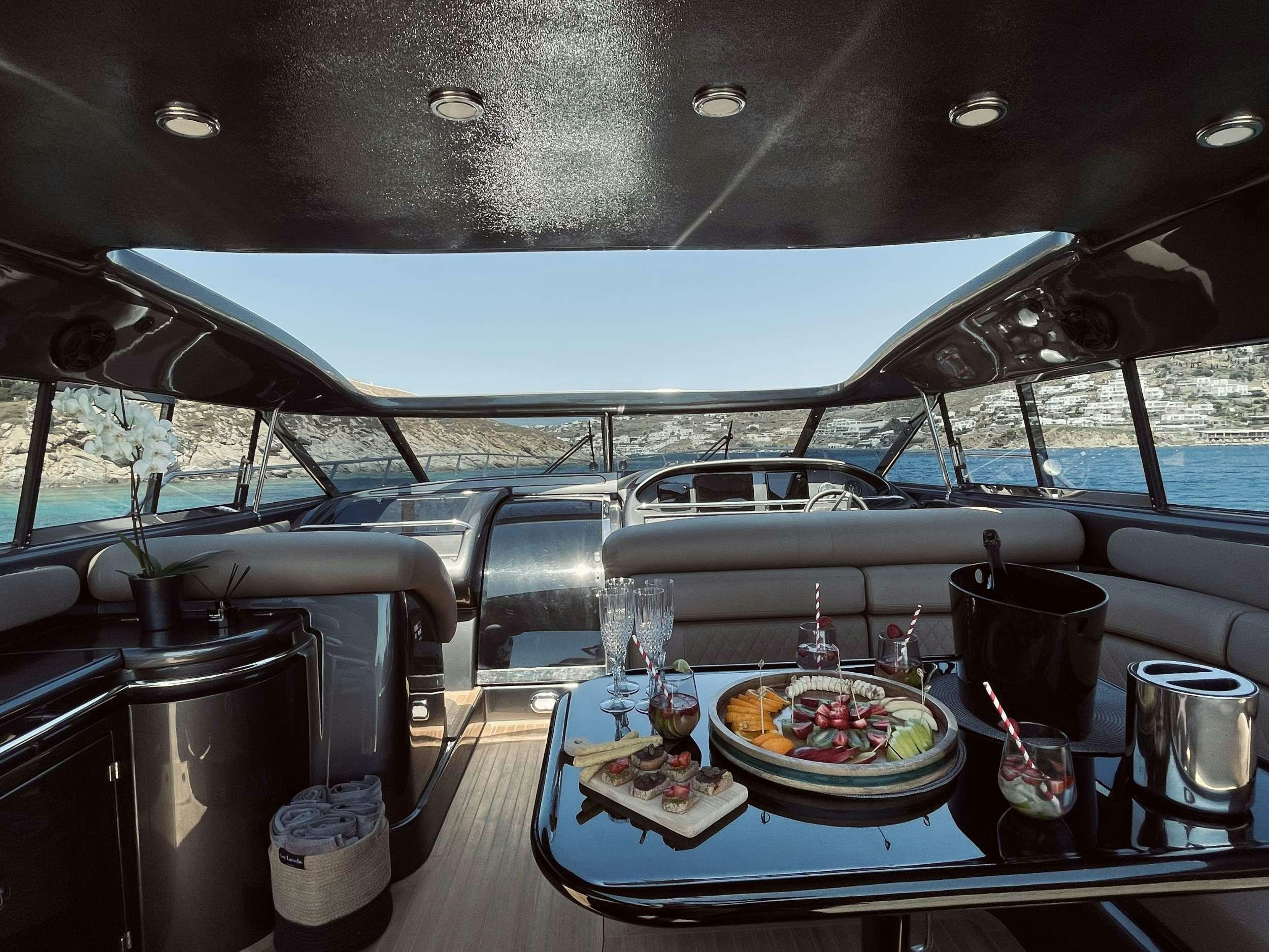 a table with food on it aboard 007 Yacht for Charter