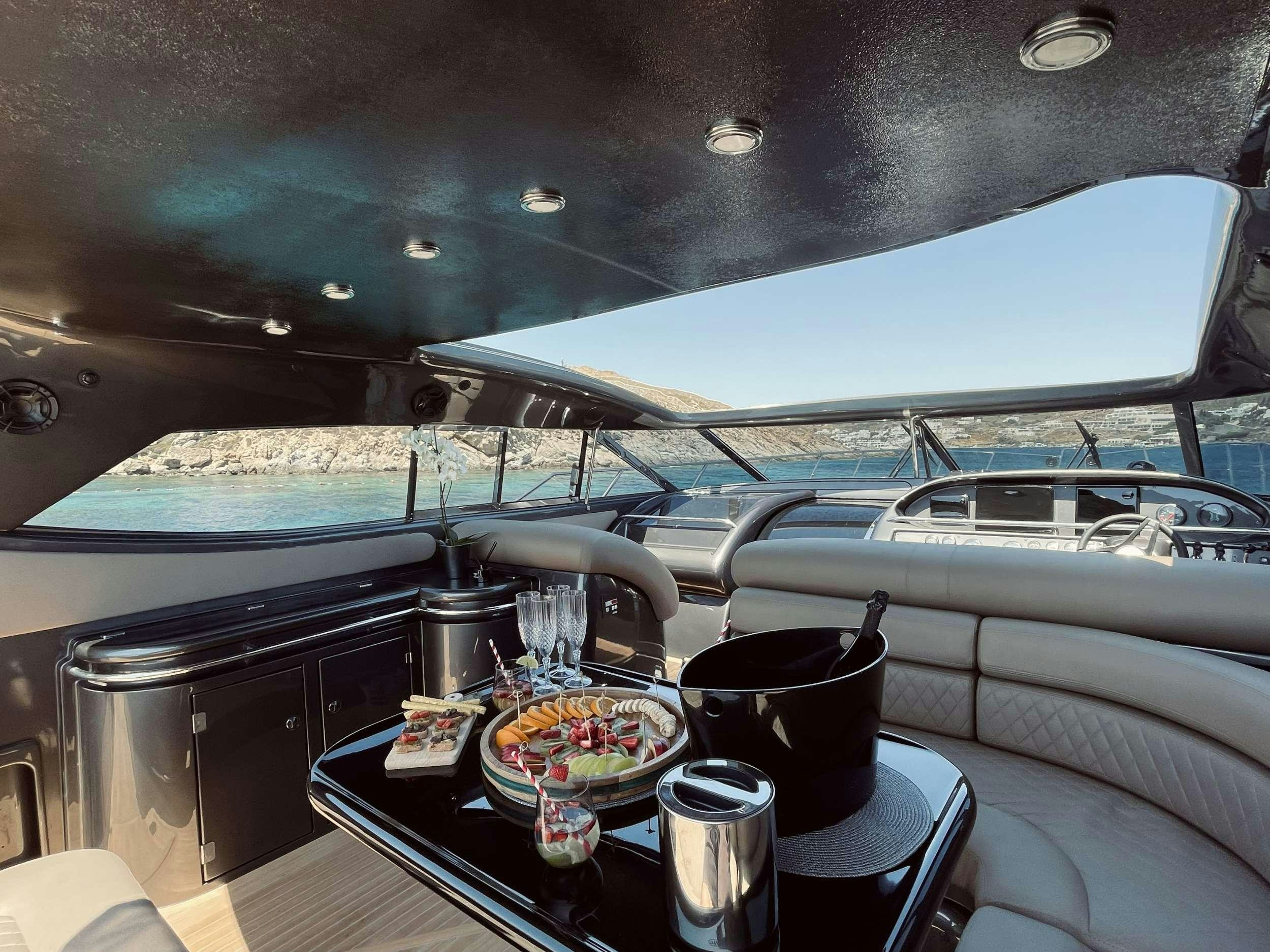 a table with food on it aboard 007 Yacht for Charter