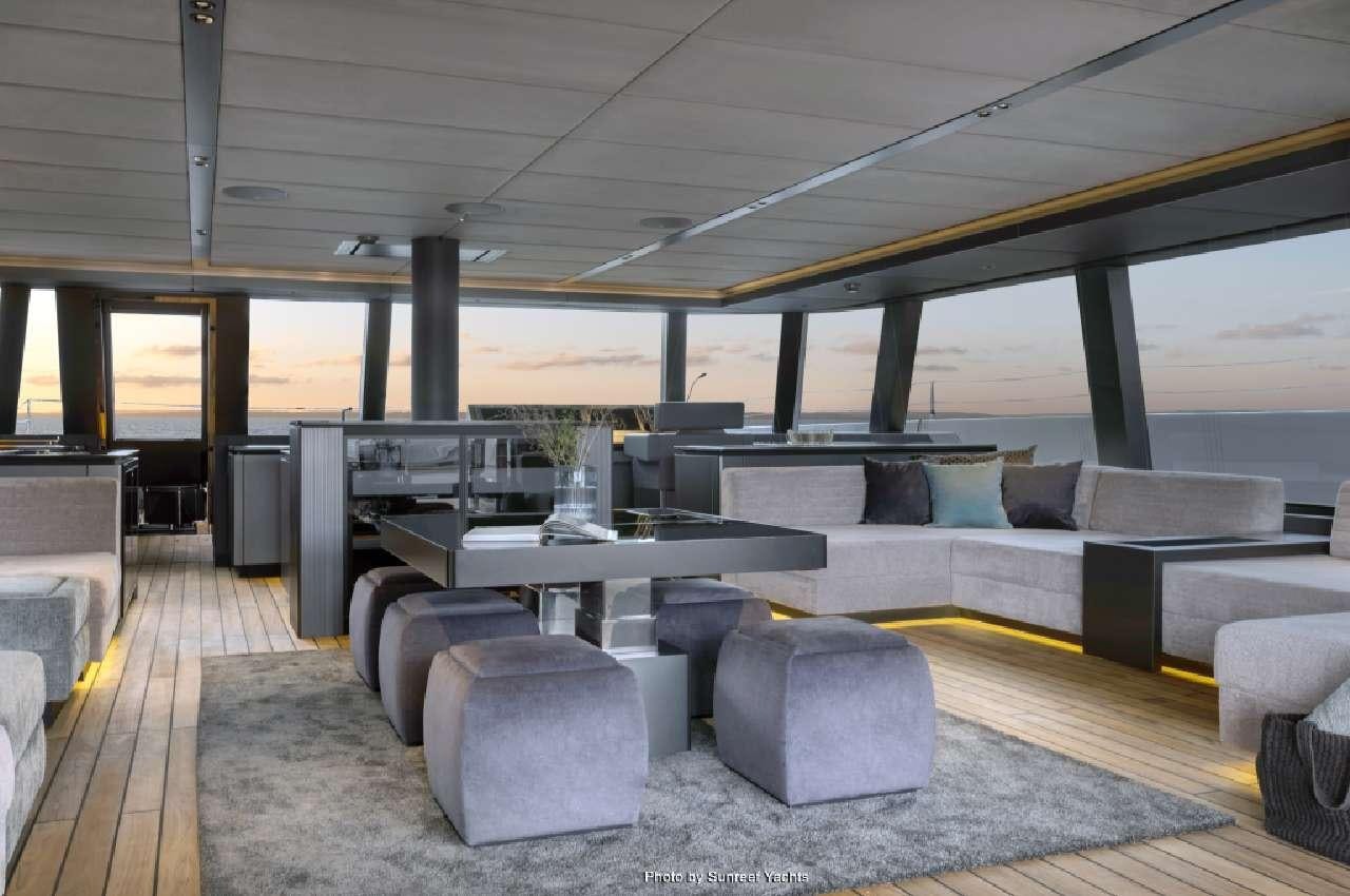 a room with a couch and a table aboard SHADES OF GREY Yacht for Charter