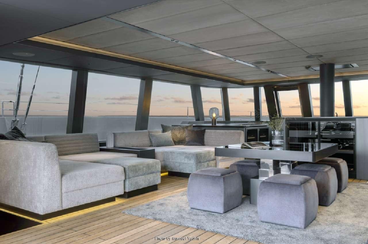 a room with couches and tables aboard SHADES OF GREY Yacht for Charter