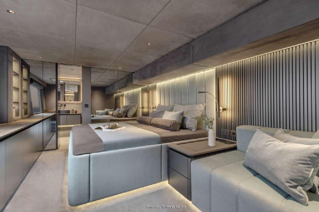 a room with a couch and a table aboard SHADES OF GREY Yacht for Charter