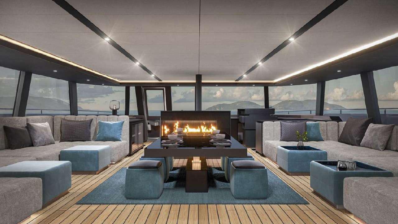 a living room with a large fireplace aboard SHADES OF GREY Yacht for Charter
