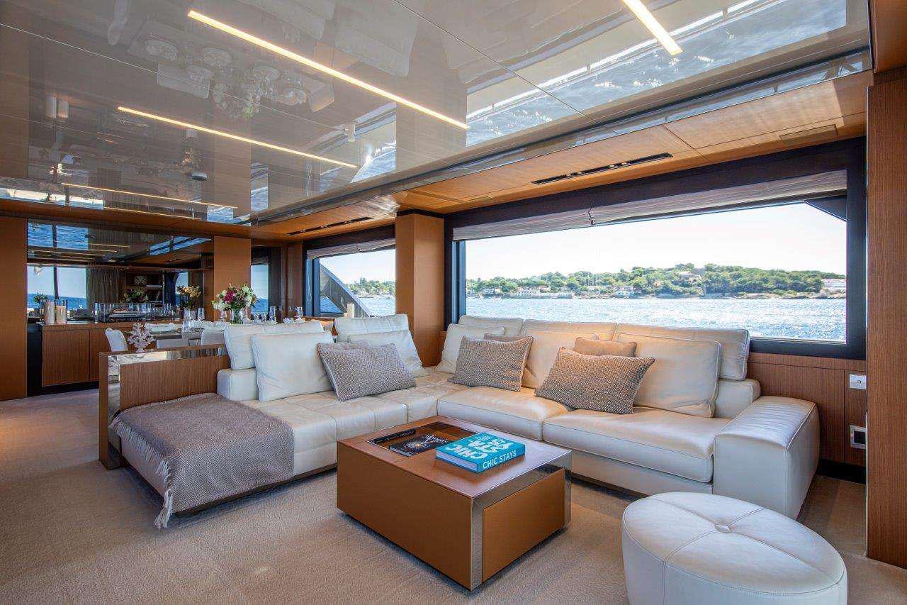 a living room with a couch and a coffee table aboard NO STRESS 888 Yacht for Charter