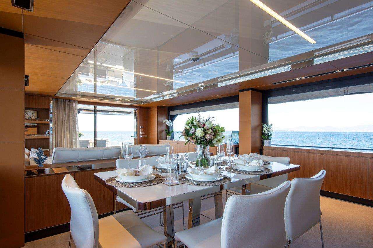 a dining table set for a dinner aboard NO STRESS 888 Yacht for Charter