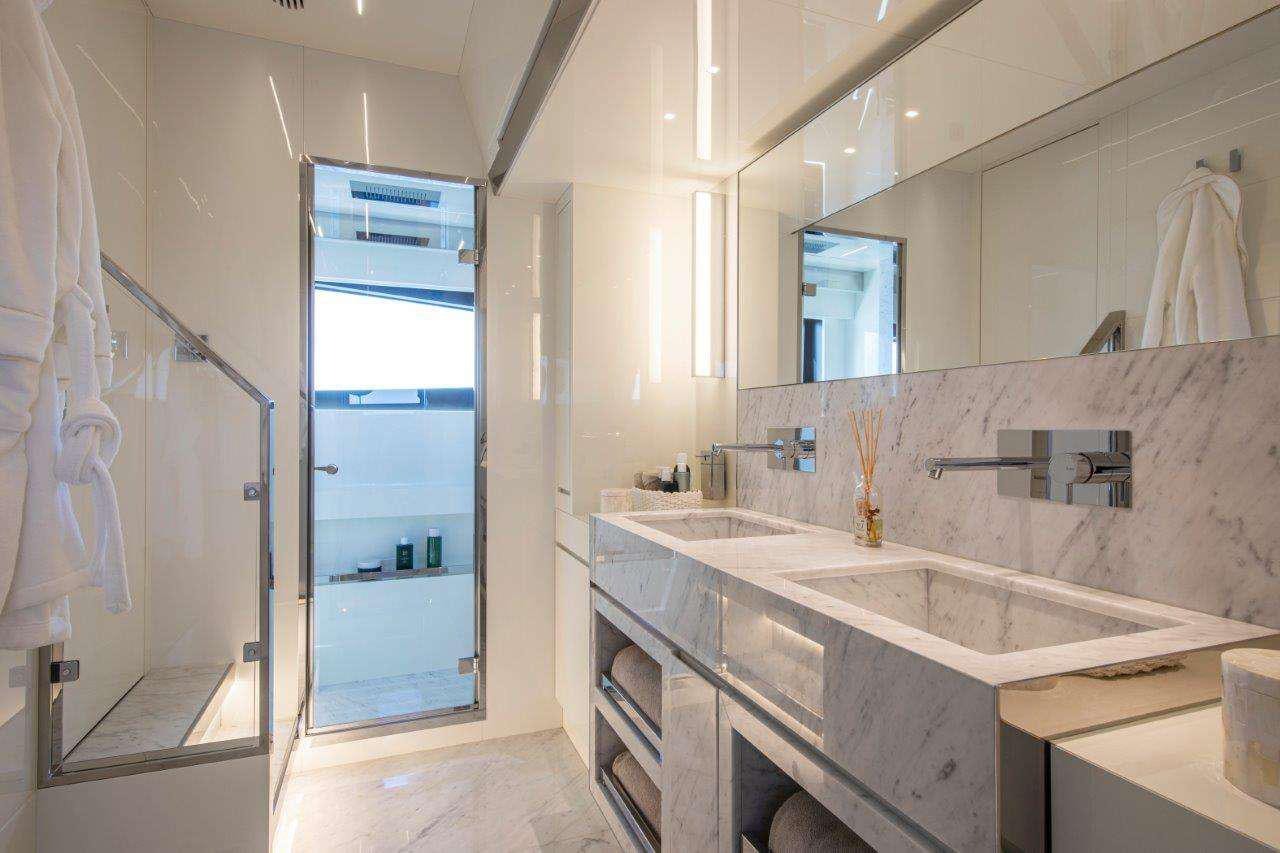 a bathroom with a sink and a mirror aboard NO STRESS 888 Yacht for Charter