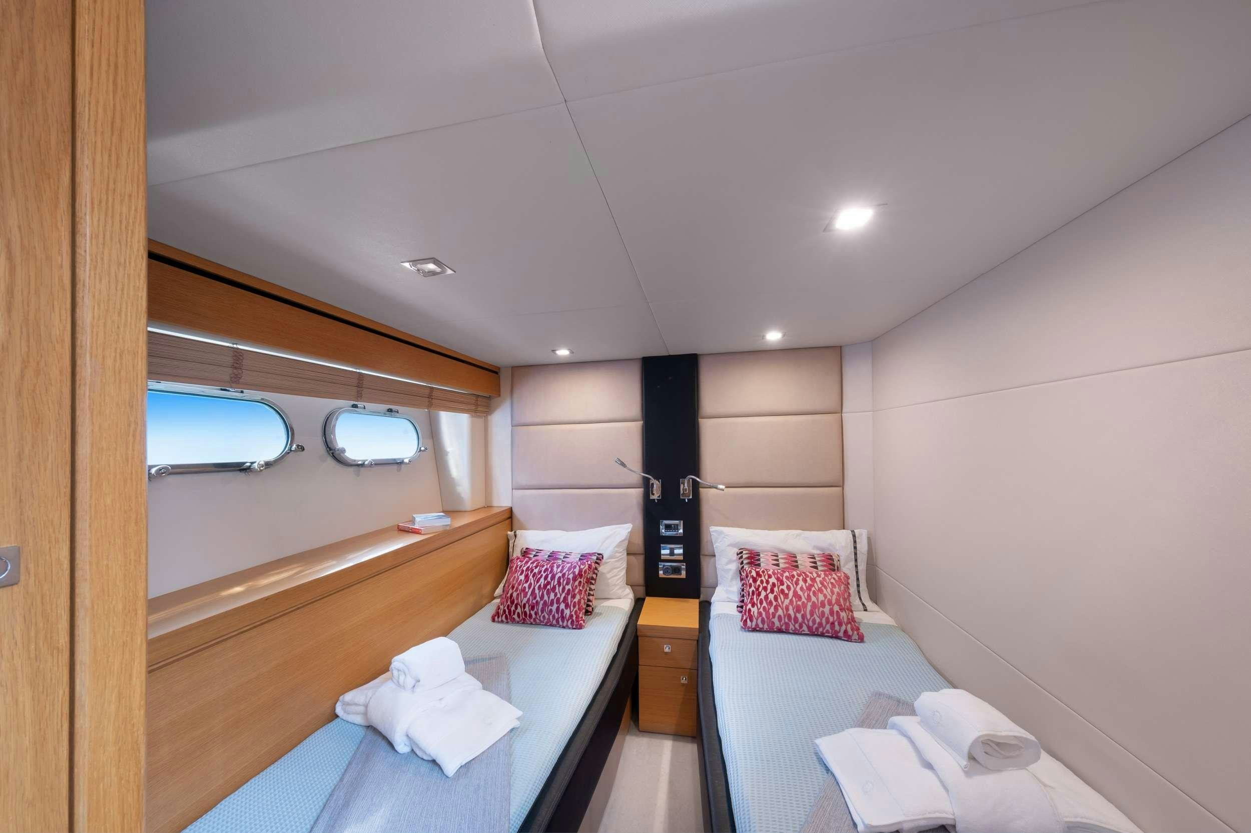 a room with a bed and a window aboard POLPO Yacht for Charter