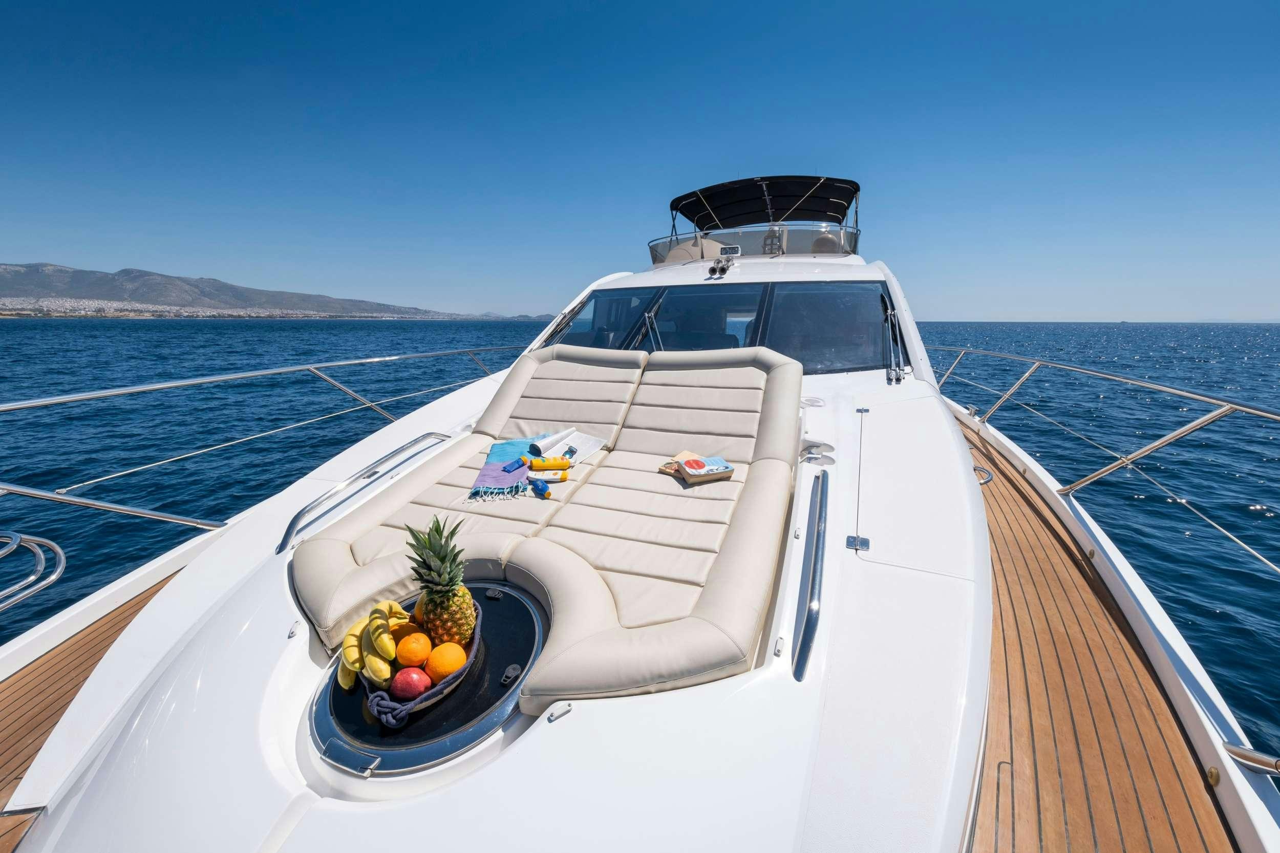 a white boat with fruit on the front aboard POLPO Yacht for Charter