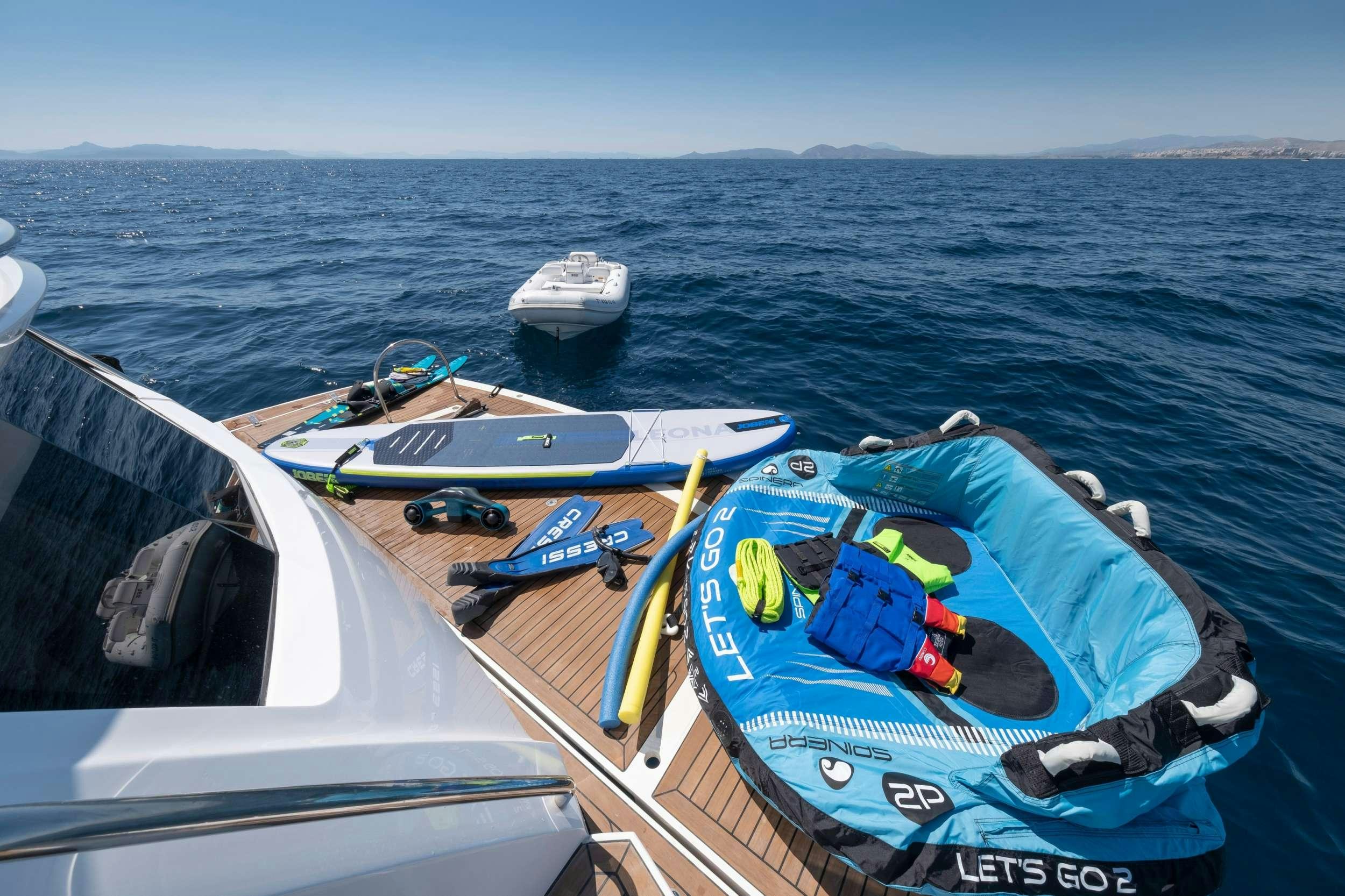 a group of boats on a body of water aboard POLPO Yacht for Charter