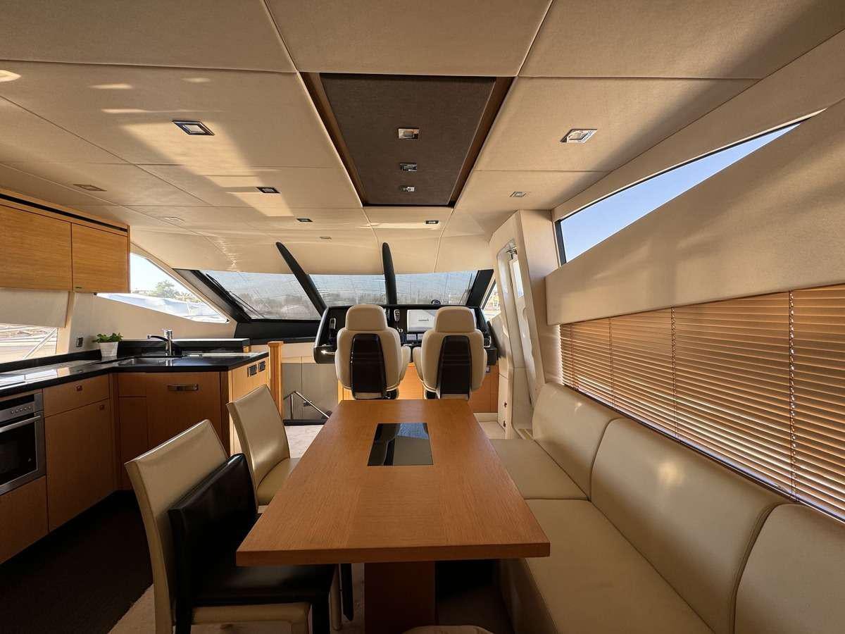 a room with a table and chairs aboard POLPO Yacht for Charter