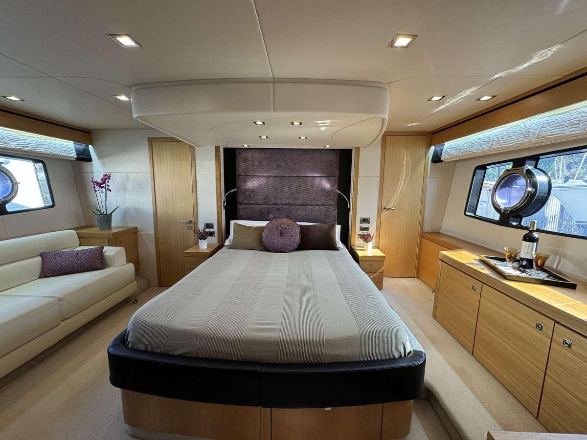 a bedroom with a bed and a desk aboard POLPO Yacht for Charter