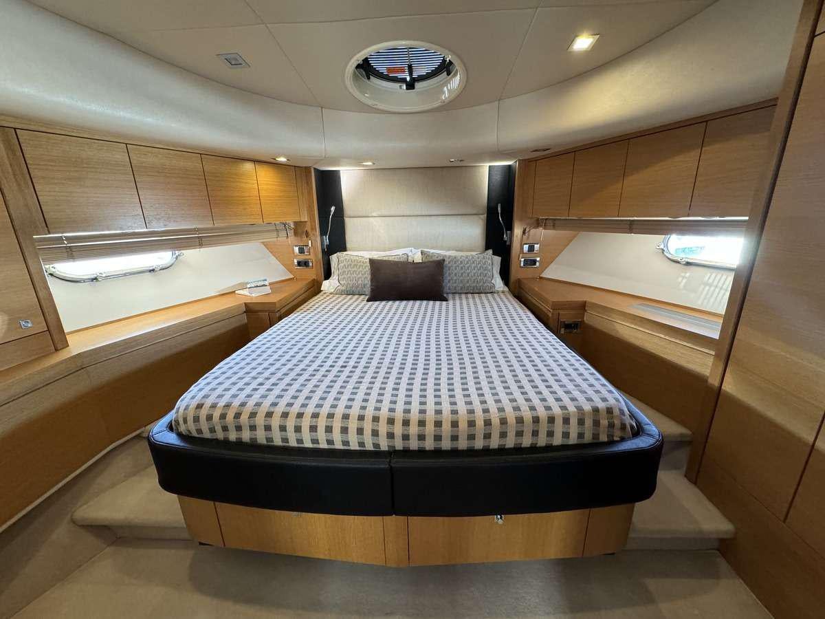 a bed in a room aboard POLPO Yacht for Charter