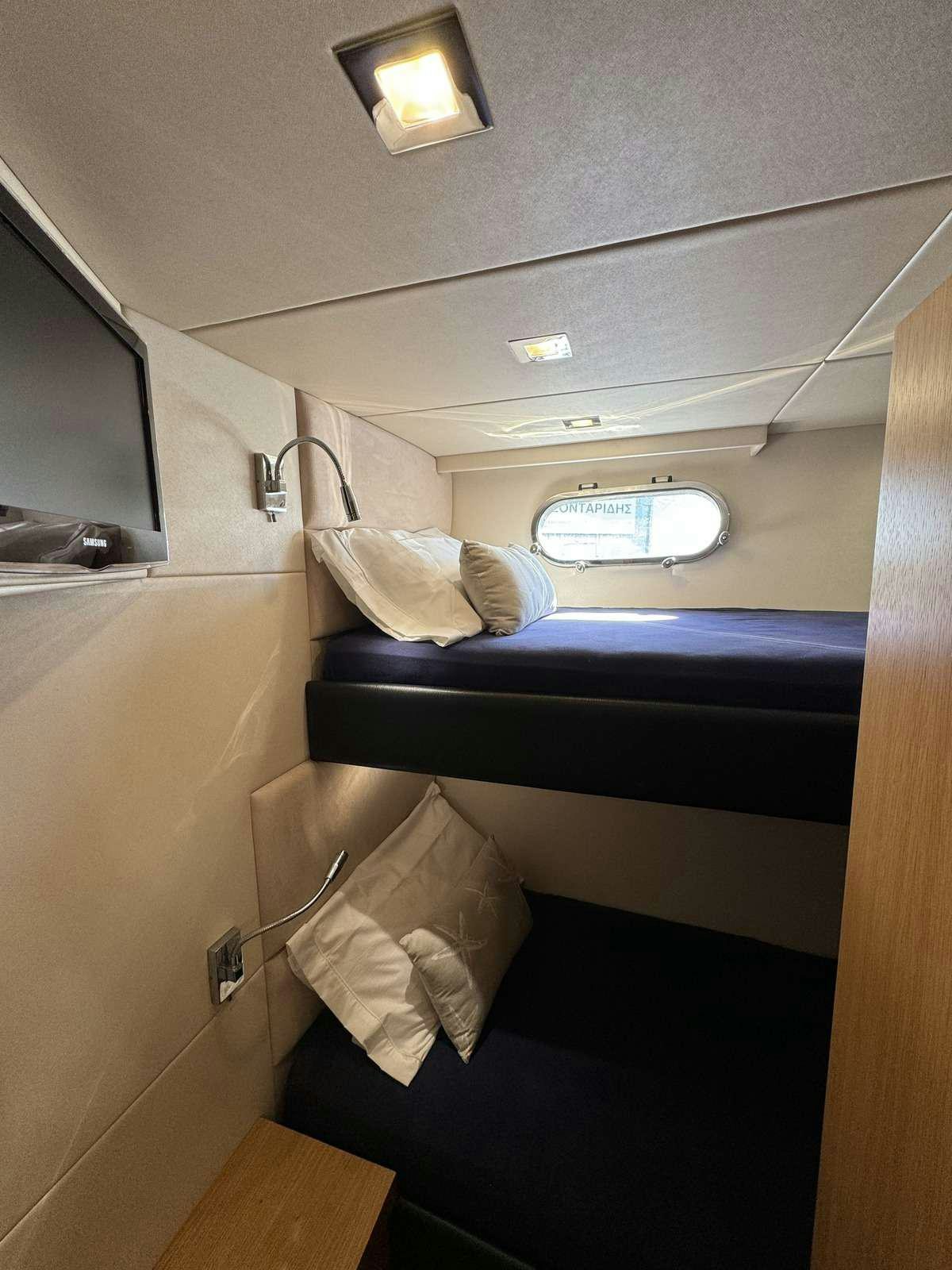 a bed in a room aboard POLPO Yacht for Charter