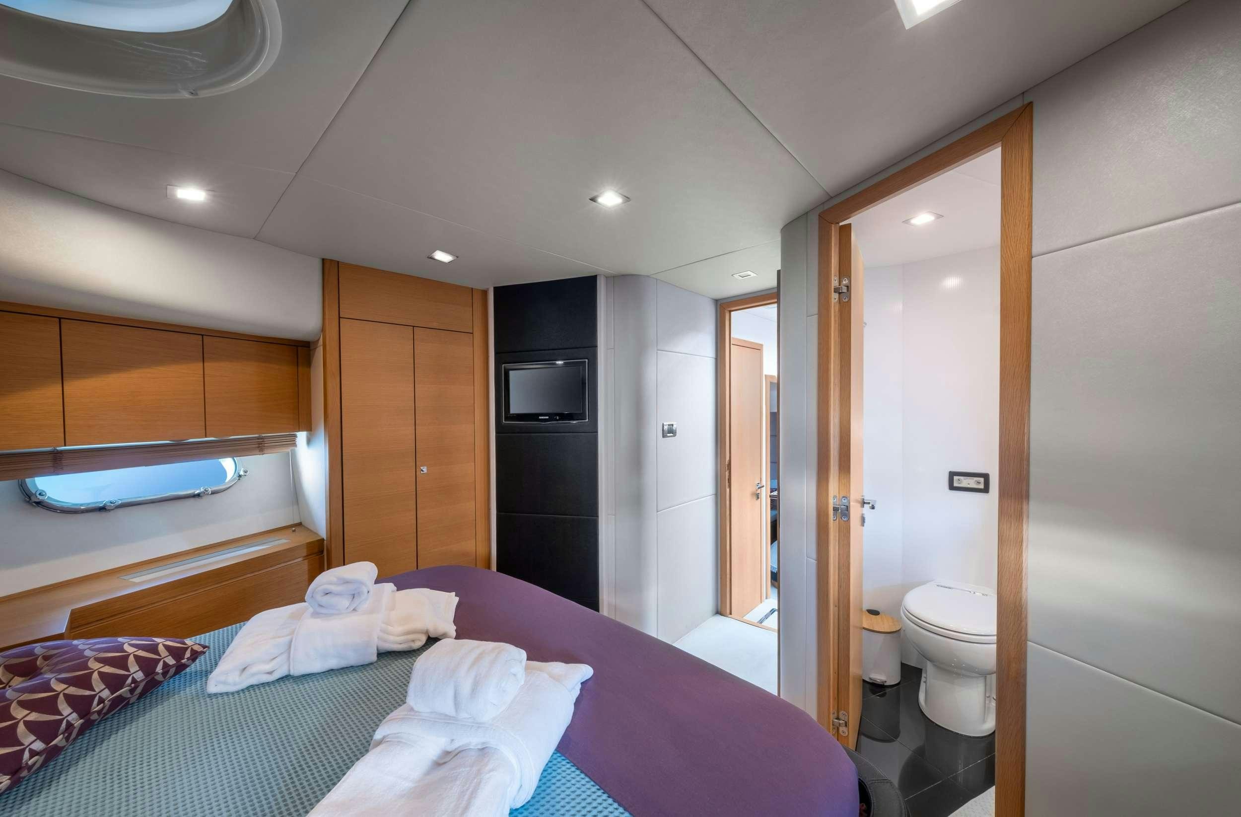 a bathroom with a bed and a bathtub aboard POLPO Yacht for Charter