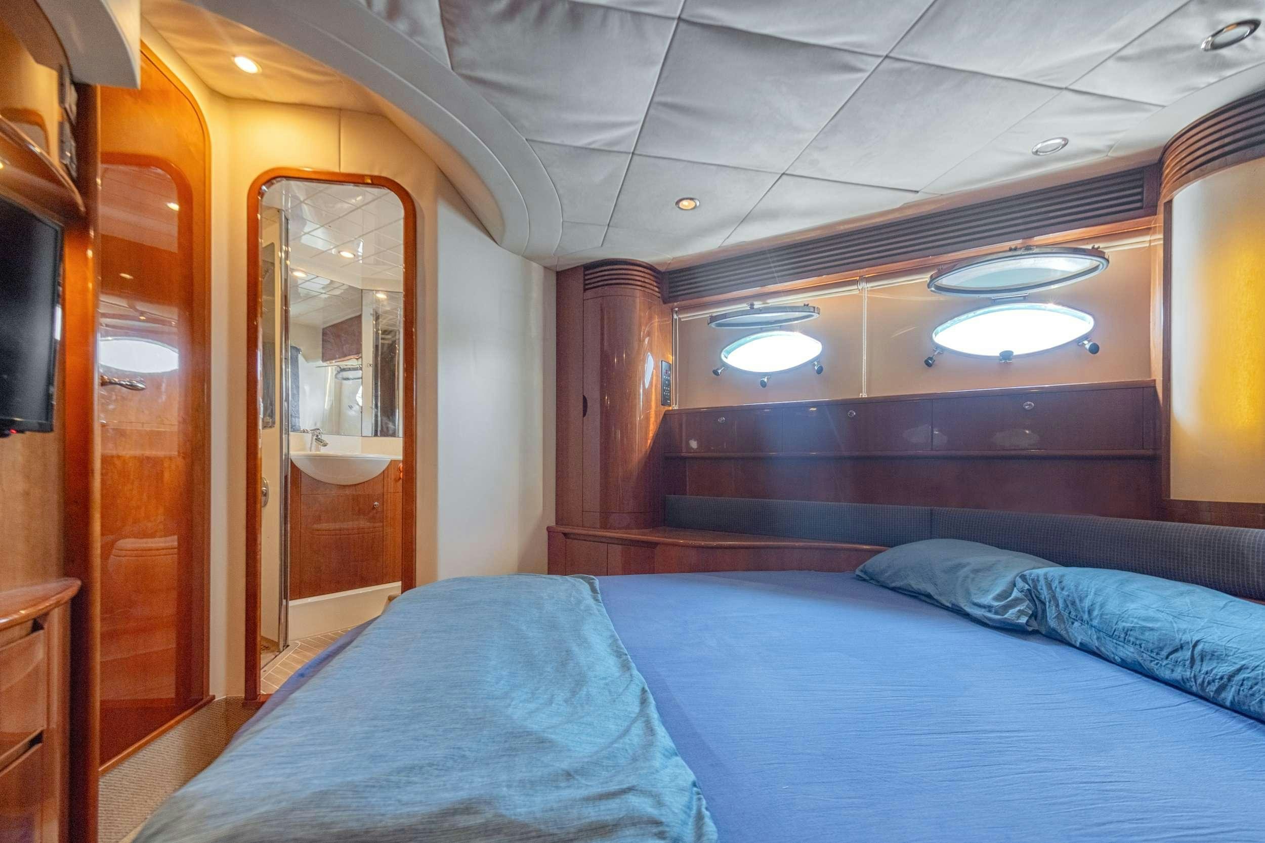 a bed in a room aboard EVENIA Yacht for Charter