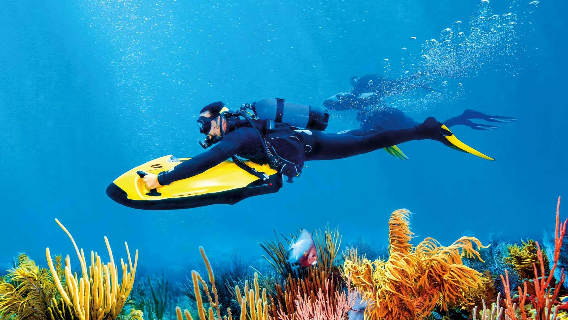 a person in a yellow kayak aboard APOLLO Yacht for Charter