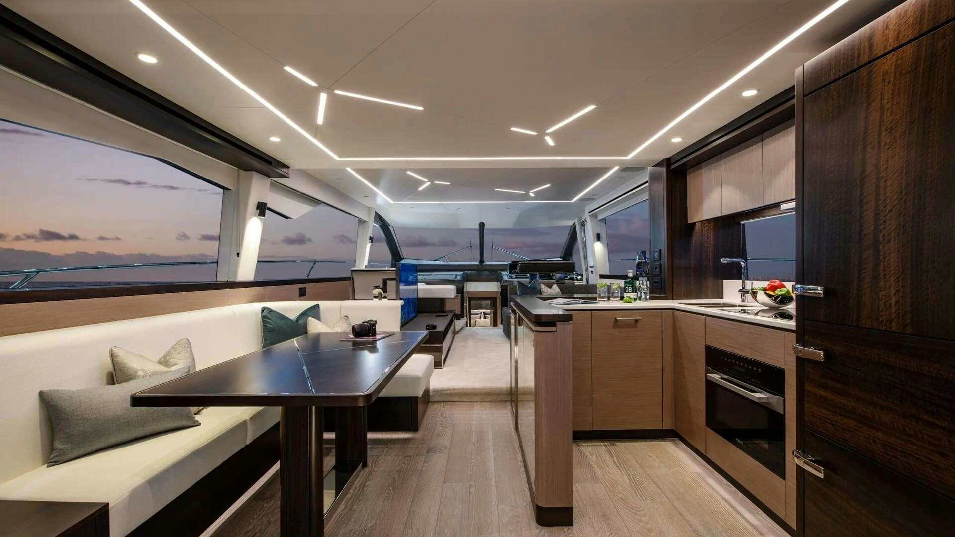 a kitchen with a table and chairs aboard APOLLO Yacht for Charter