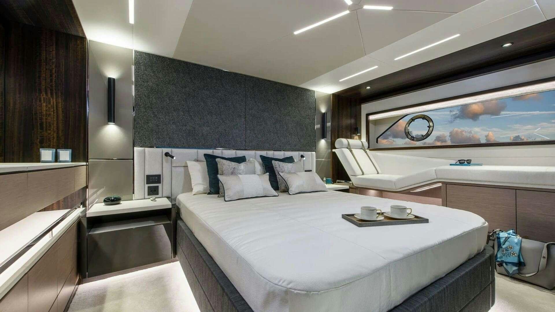 a room with a bed and a desk aboard APOLLO Yacht for Charter