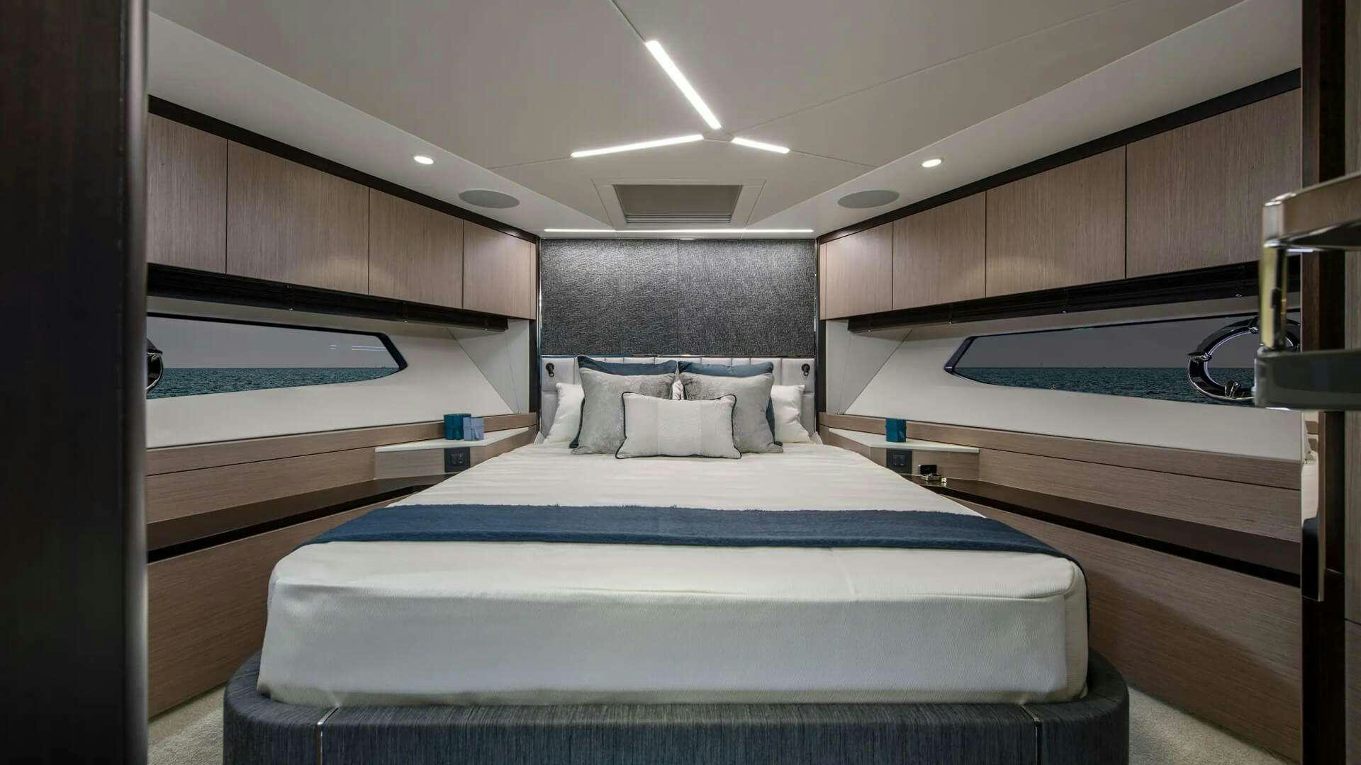 a room with a bed and a sink aboard APOLLO Yacht for Charter
