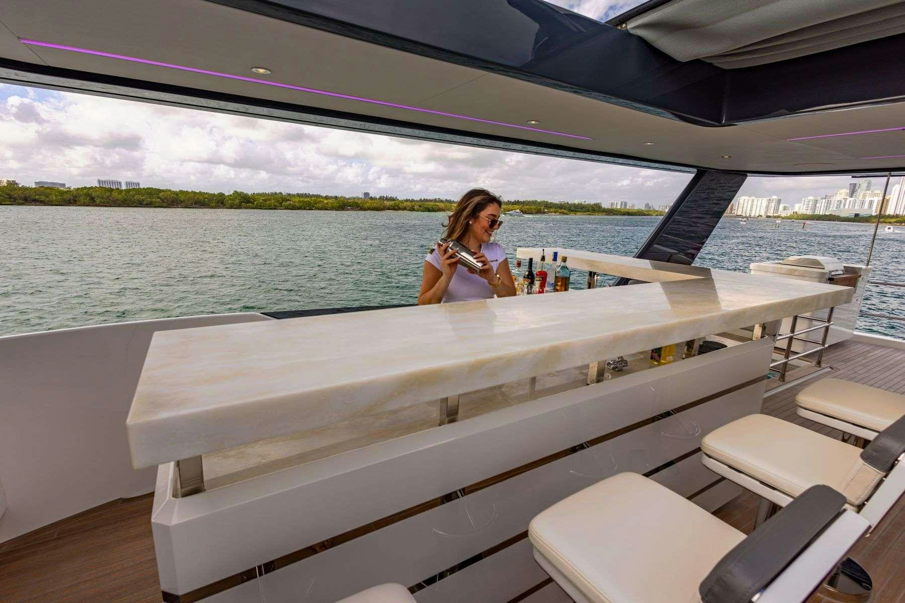 a person sitting on a boat aboard OLYMPUS Yacht for Charter