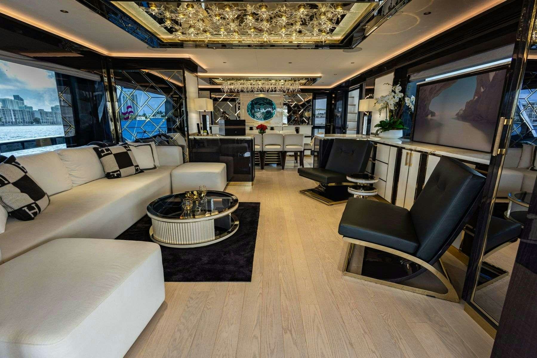 a living room with a large screen aboard OLYMPUS Yacht for Charter