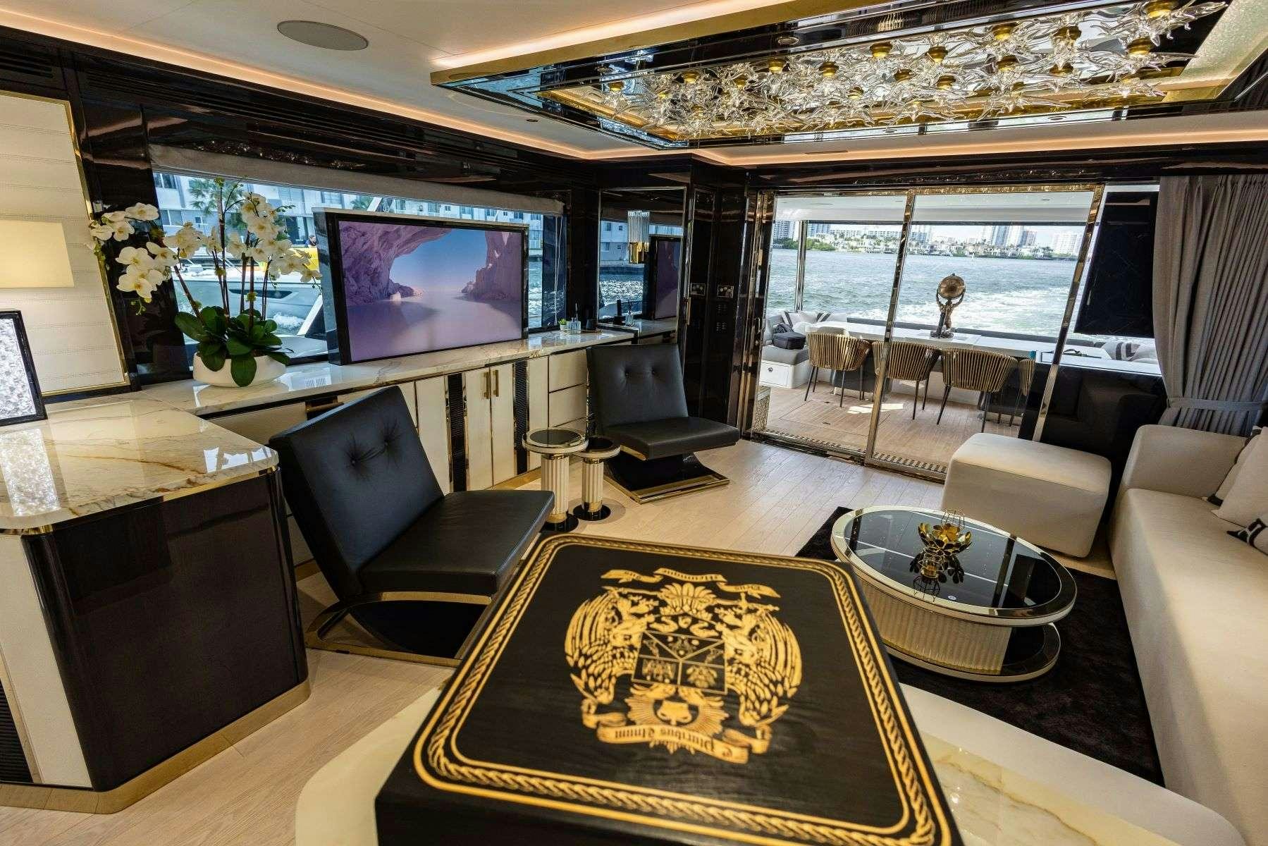 a living room with a large window aboard OLYMPUS Yacht for Charter