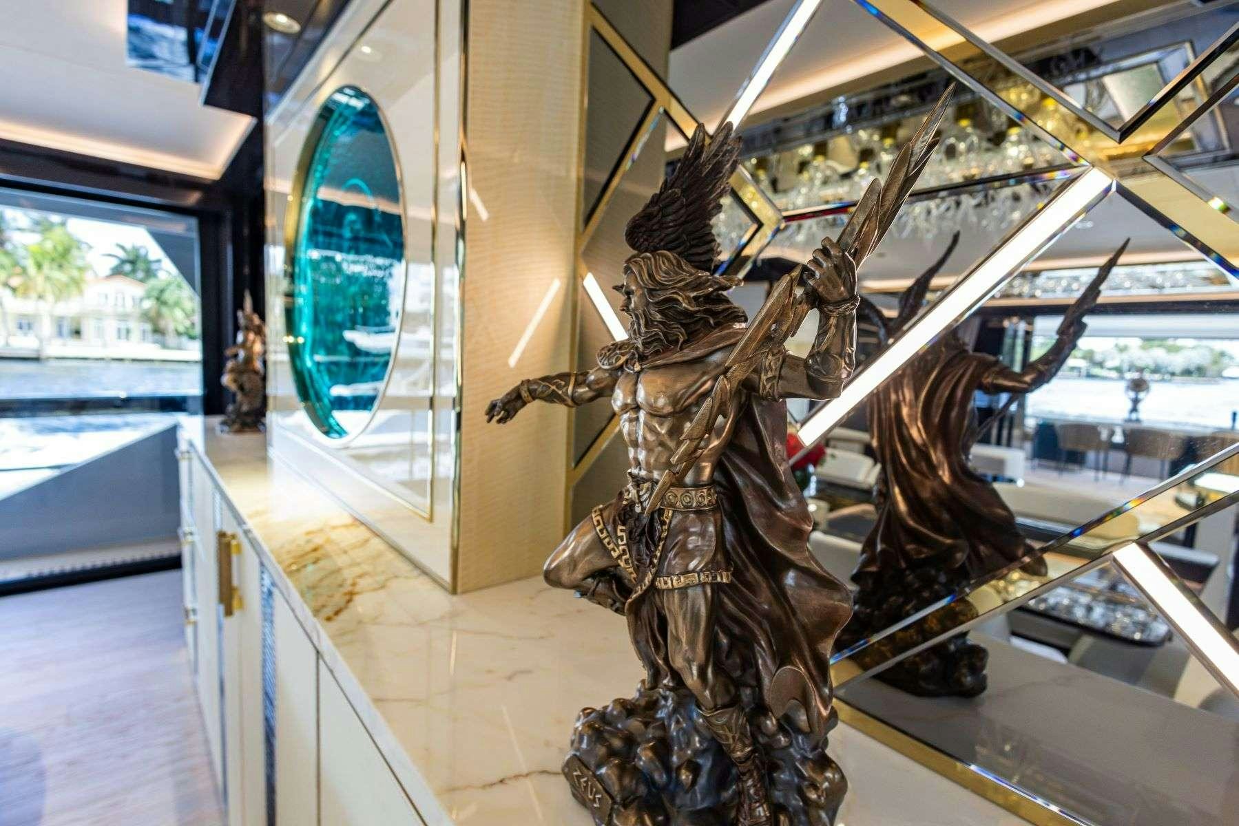 a statue of a dragon aboard OLYMPUS Yacht for Charter