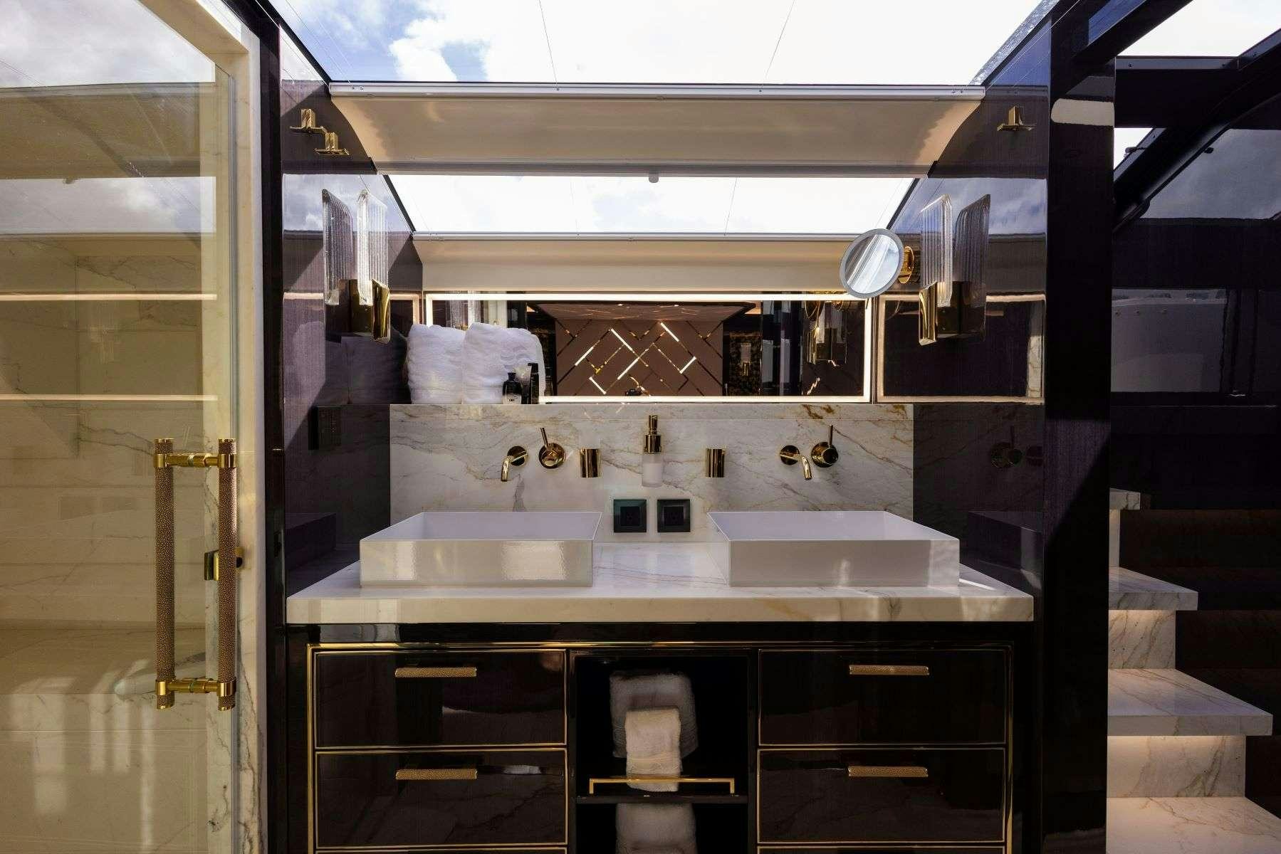 a bathroom with sinks and mirrors aboard OLYMPUS Yacht for Charter