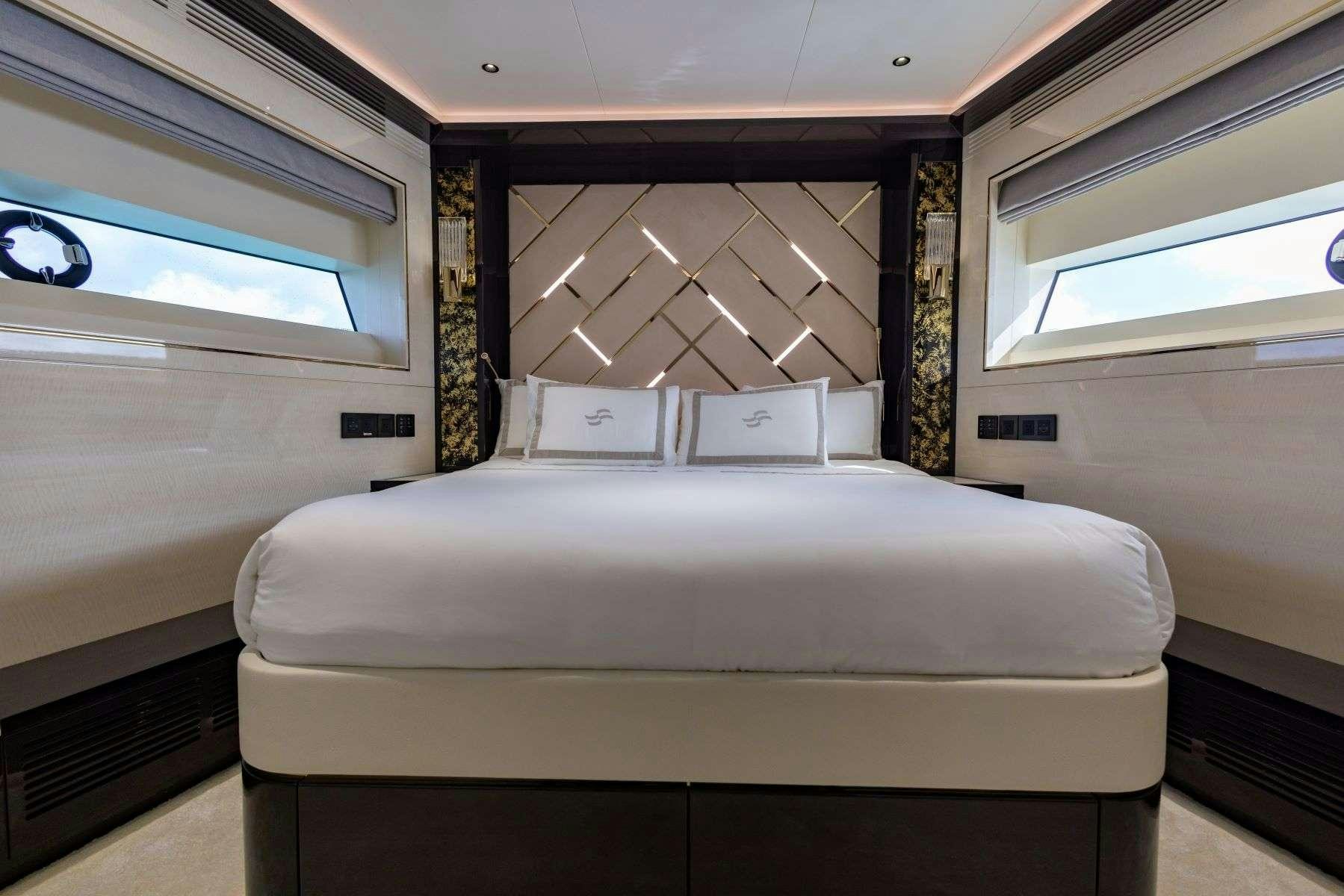 a bed in a room aboard OLYMPUS Yacht for Charter