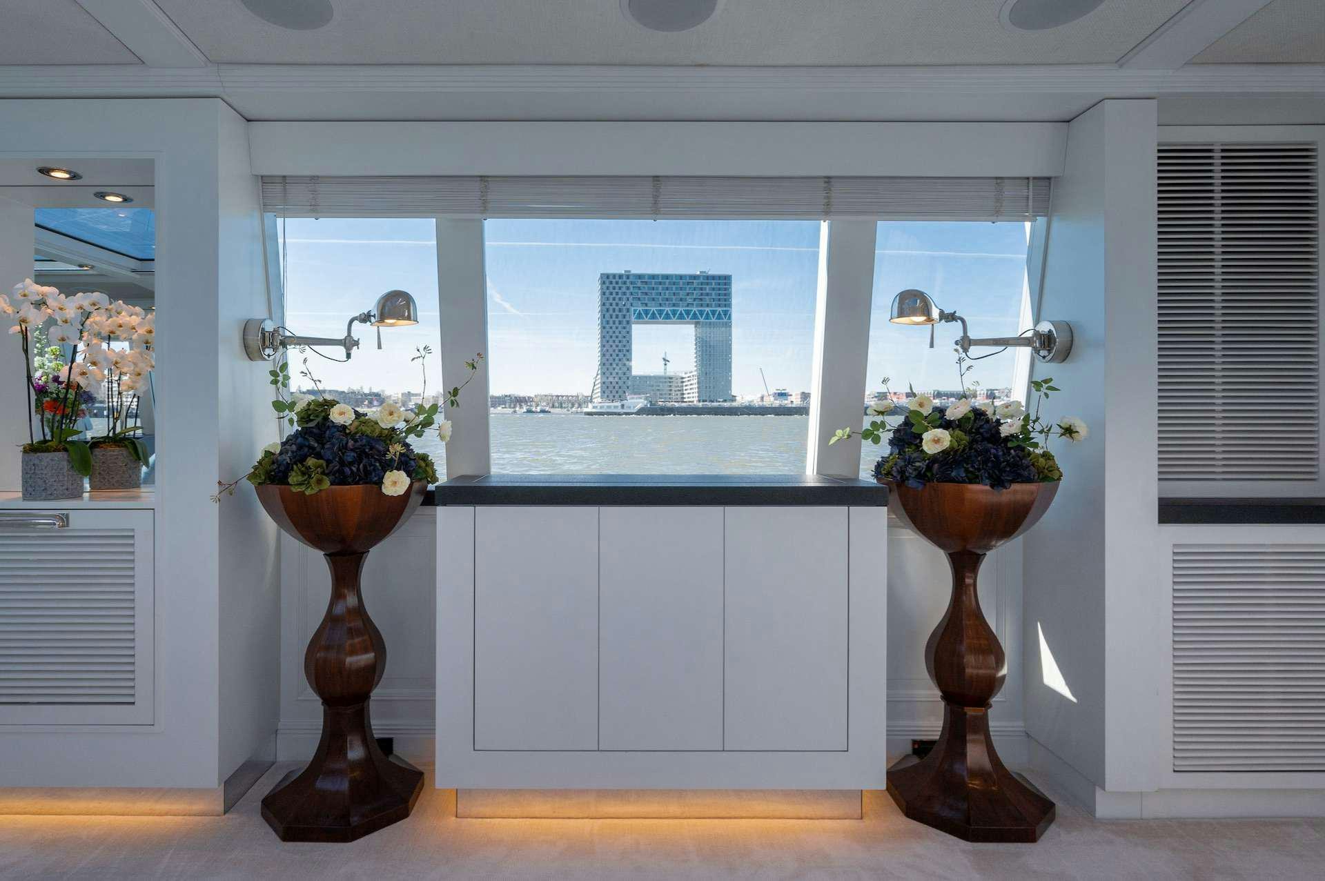 a vase with flowers in it aboard WONDERLAND Yacht for Charter