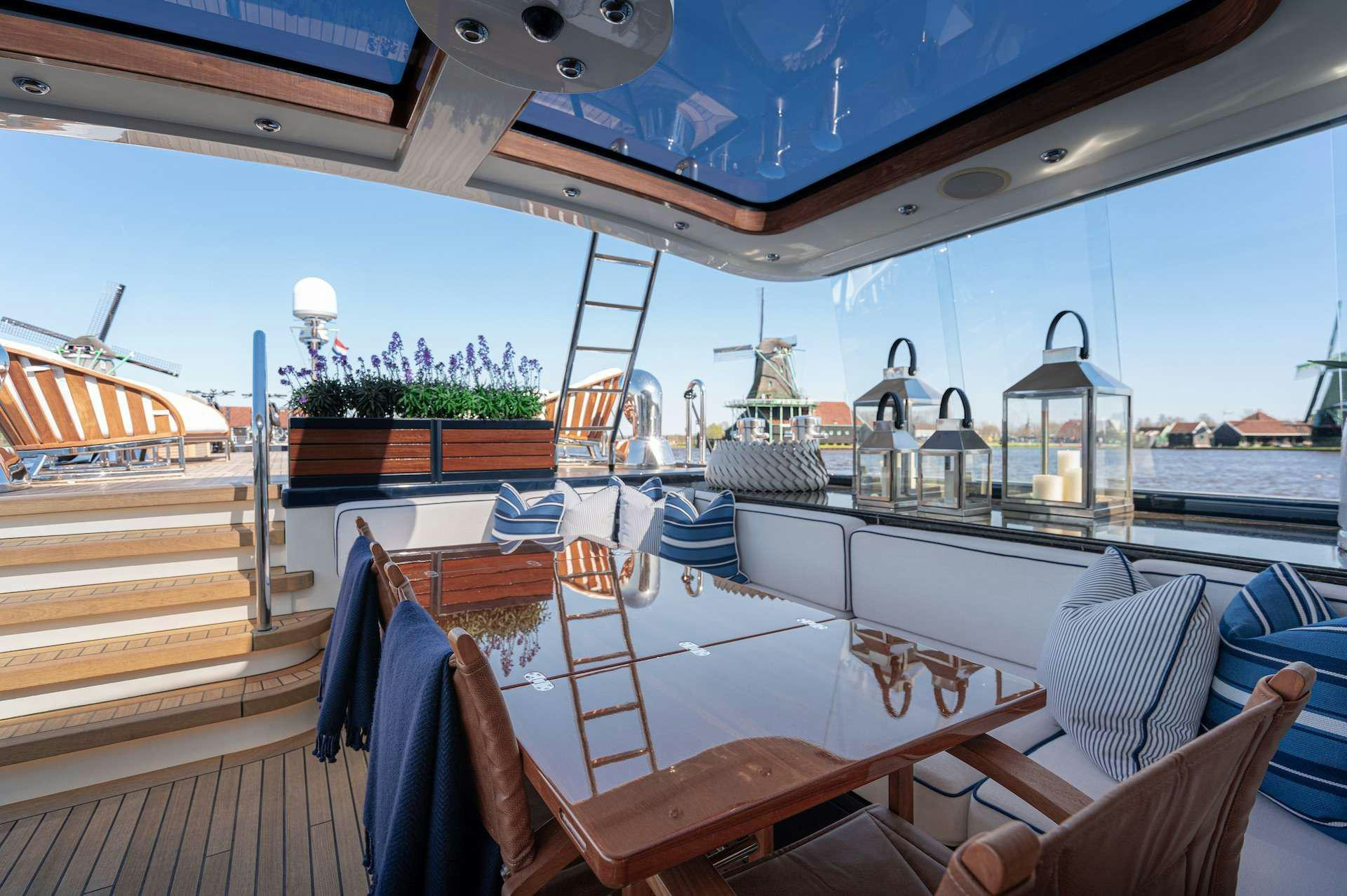 a boat with a deck and chairs aboard WONDERLAND Yacht for Charter