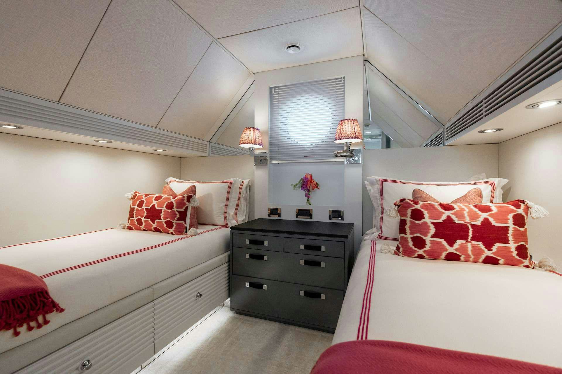 a room with two beds aboard WONDERLAND Yacht for Charter