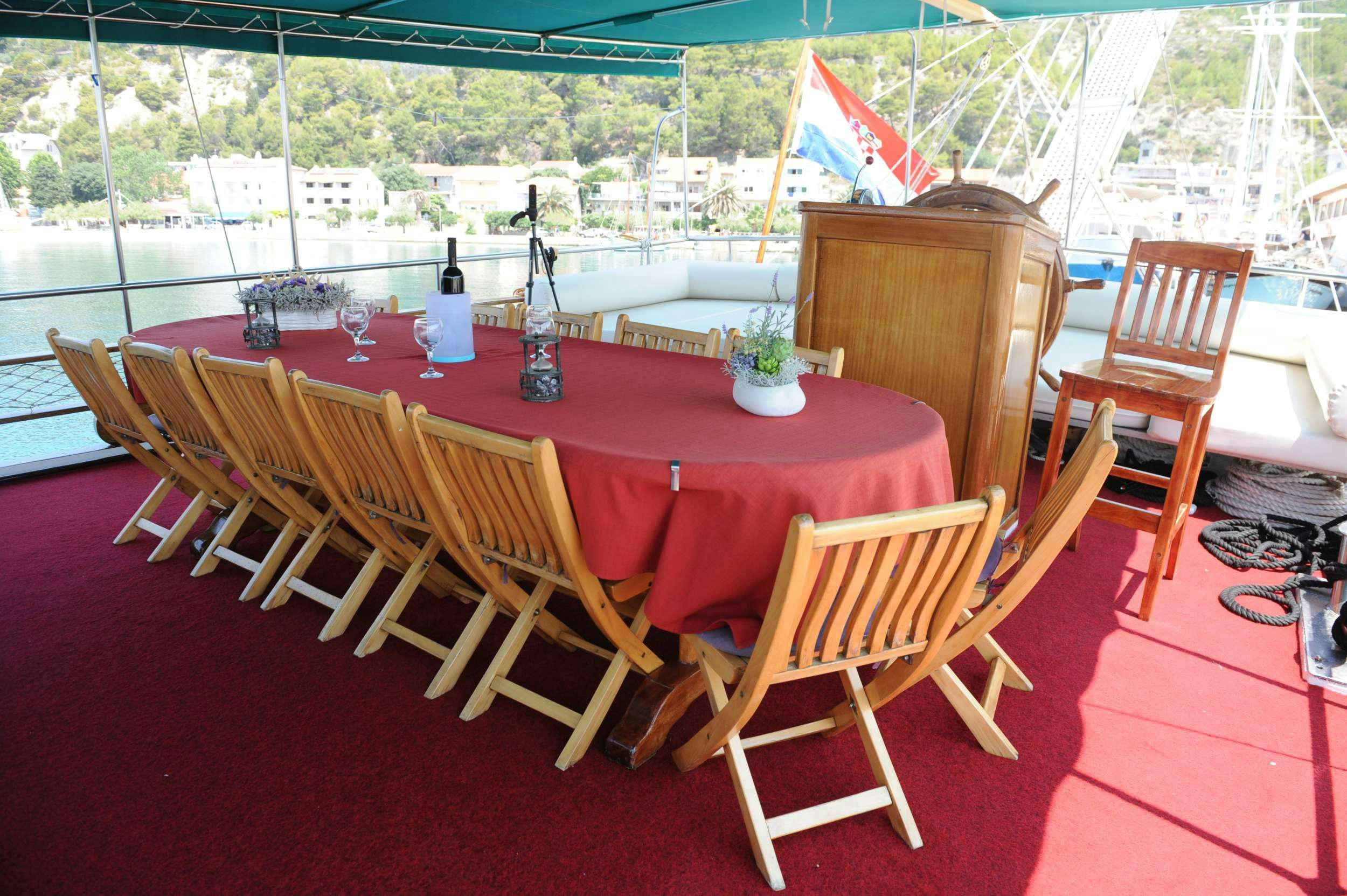 a table set up for a party aboard AGORA Yacht for Charter