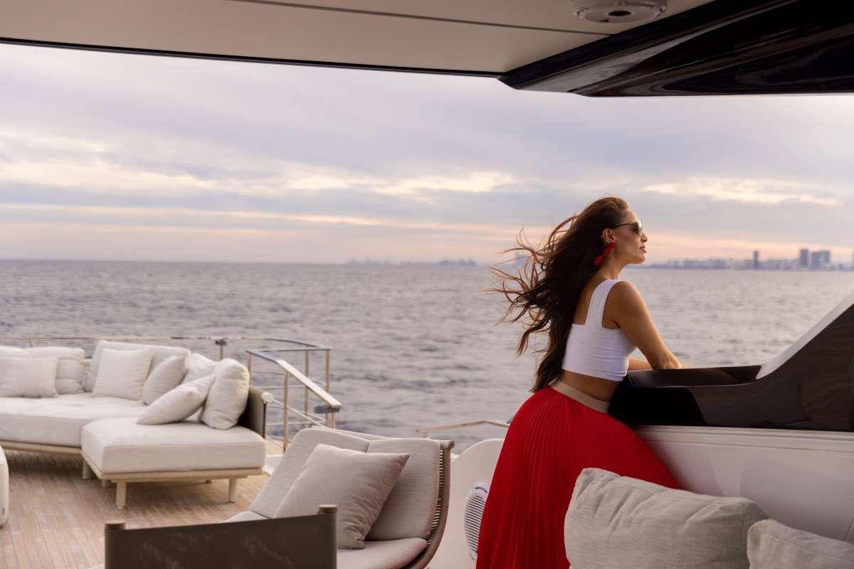 a person sitting on a couch aboard KARMA  Yacht for Charter
