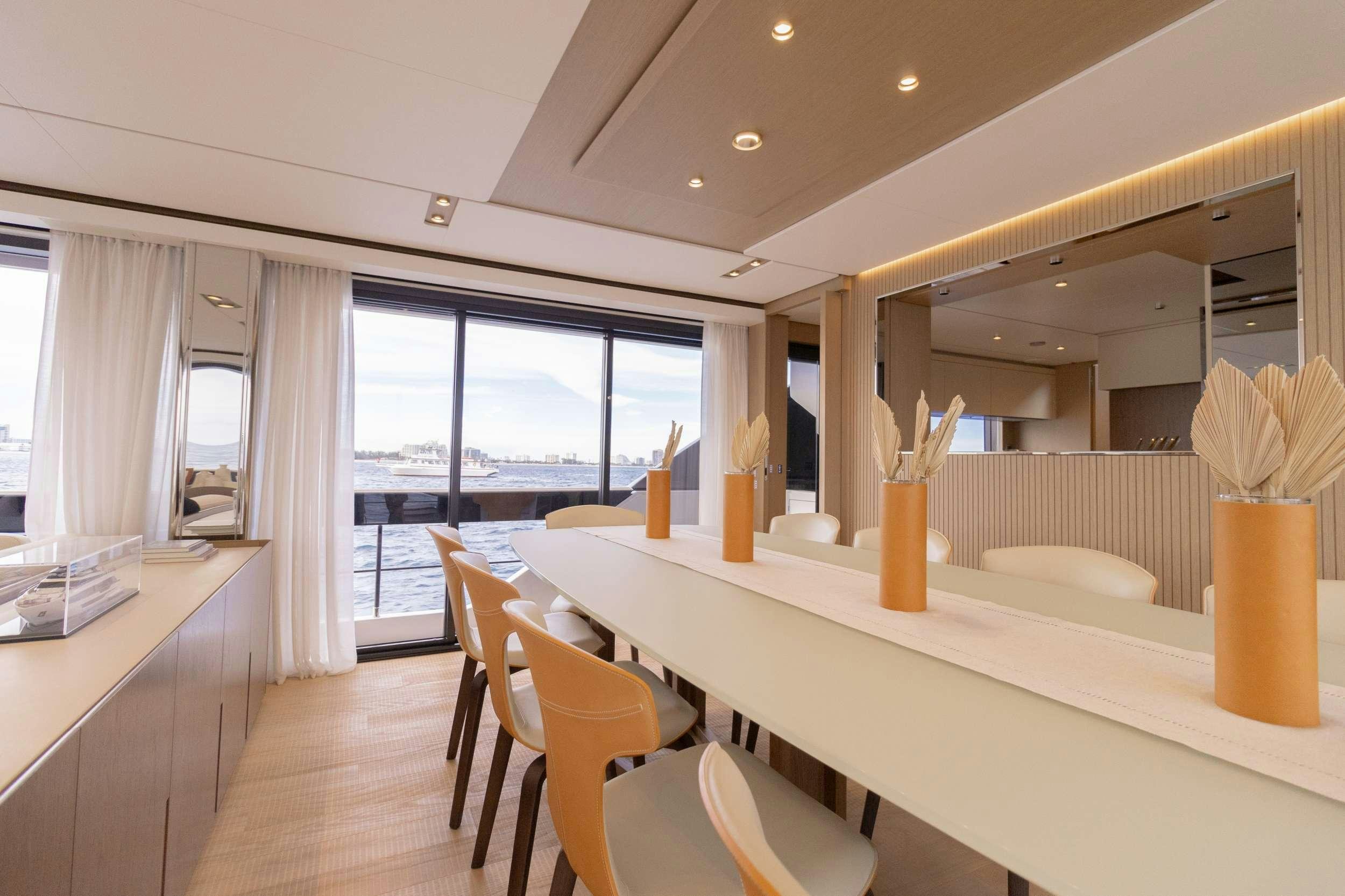 a room with a table and chairs aboard KARMA  Yacht for Charter