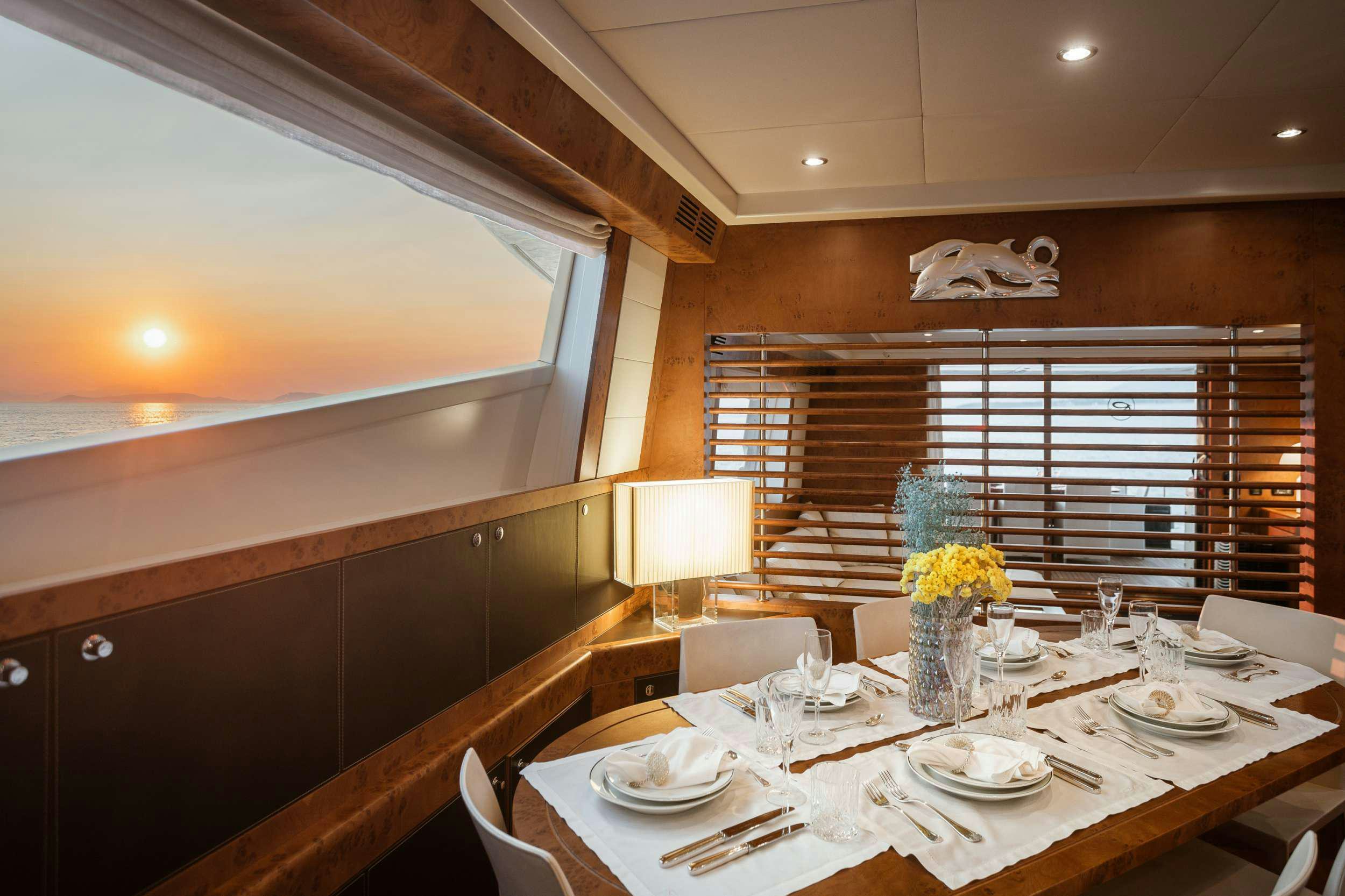 a dining table in a room aboard ANLIA Yacht for Charter