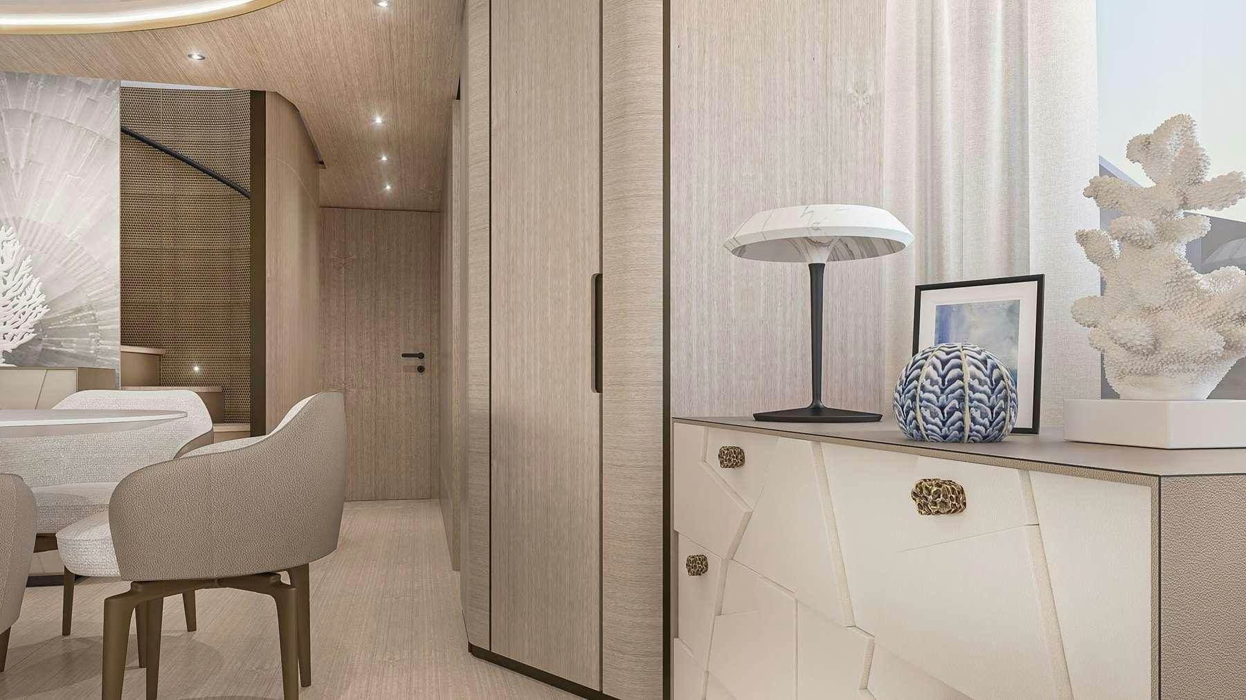 a room with a white chair and a white table and a lamp aboard UNIQUE S Yacht for Charter