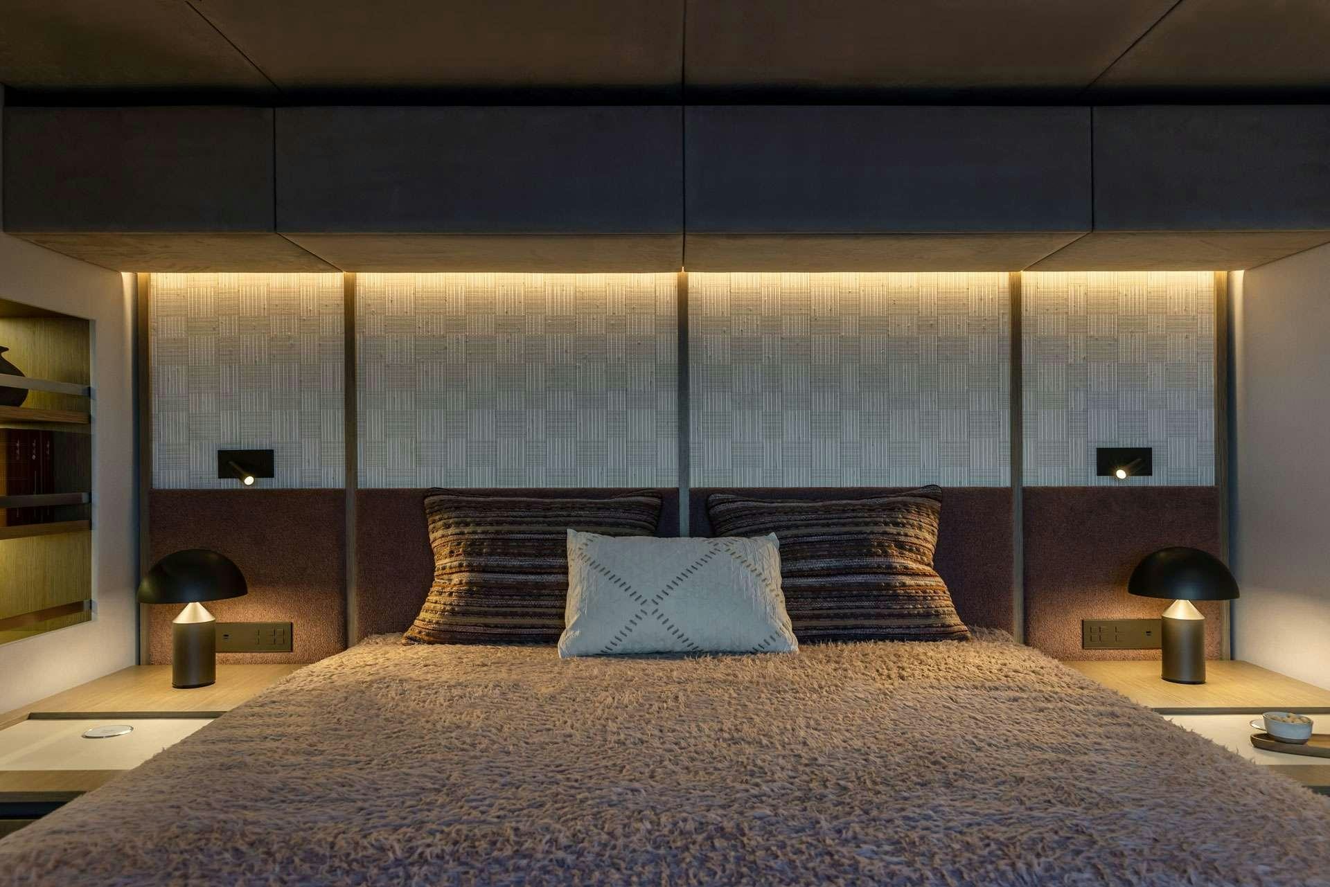 a large bed with pillows aboard OTOCTONE Yacht for Charter