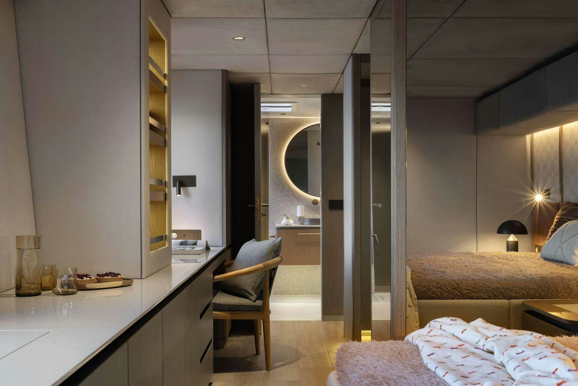 a room with a desk and a chair aboard OTOCTONE Yacht for Charter
