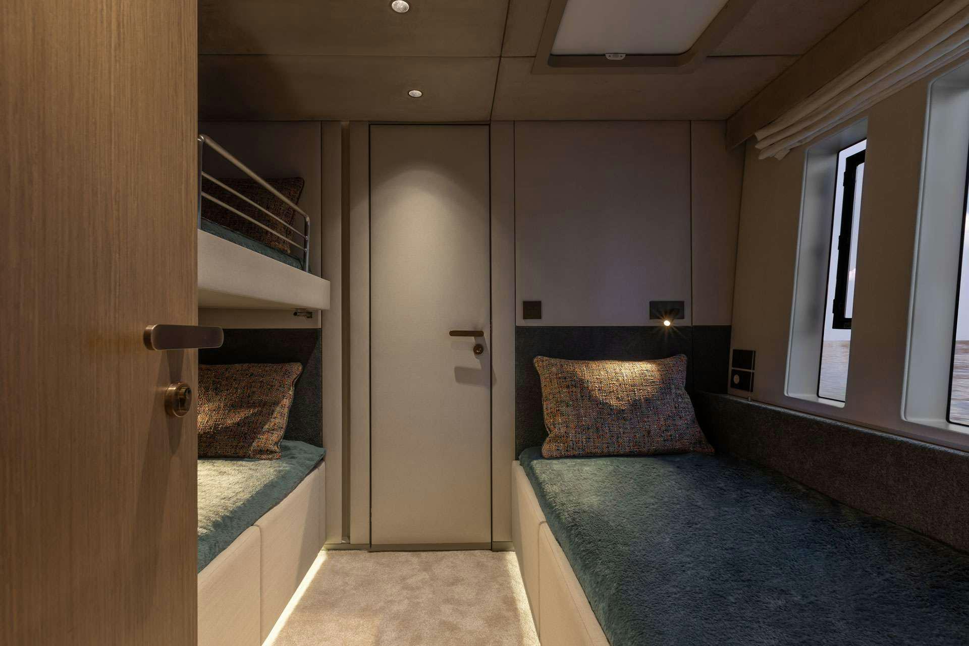 a bedroom with a bed and a door aboard OTOCTONE Yacht for Charter