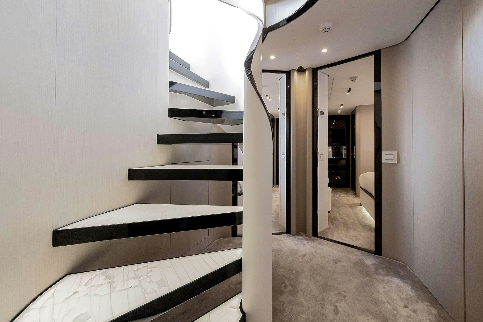 a hallway with white walls aboard NEMESIS Yacht for Charter