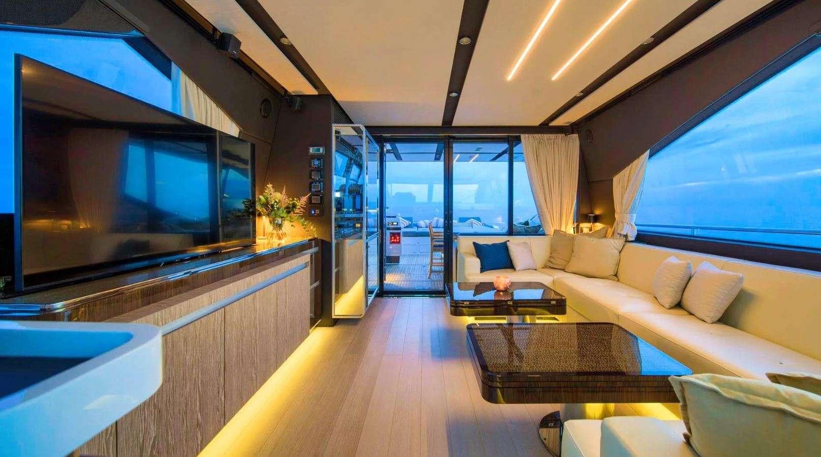 a living room with a large window aboard AZIMUT S7 - MUDITA Yacht for Charter