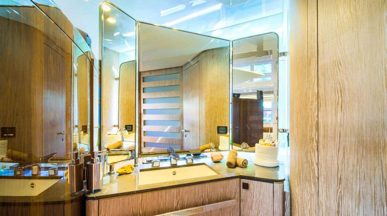 a kitchen with a large mirror aboard AZIMUT S7 - MUDITA Yacht for Charter