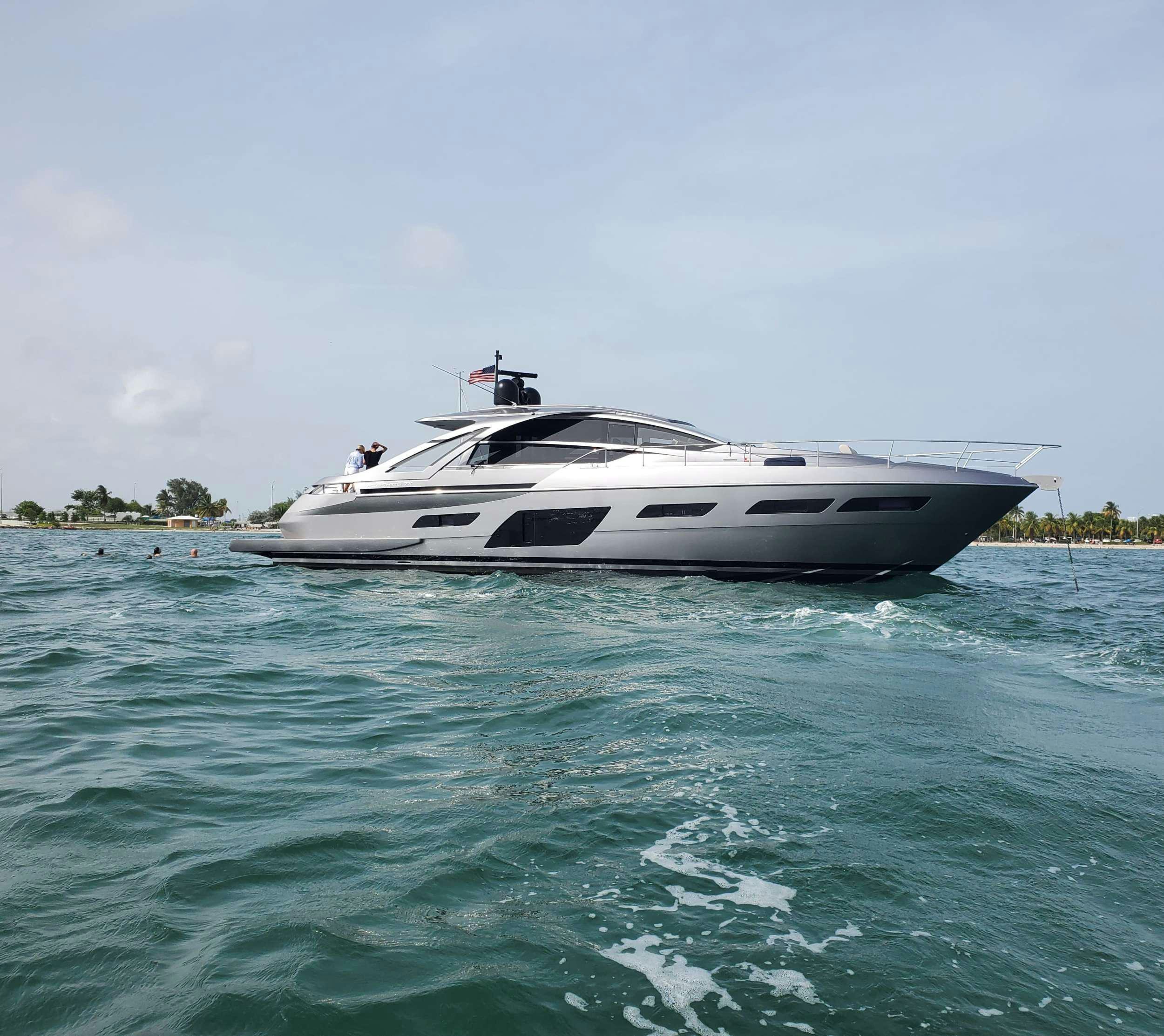 a white boat in the water aboard AMICI Yacht for Charter