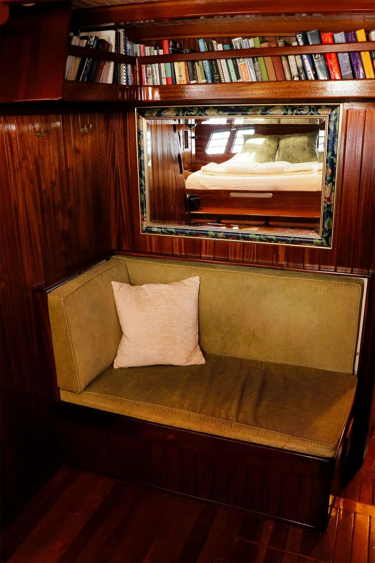 a fireplace with a mirror above it aboard TREE OF LIFE Yacht for Charter