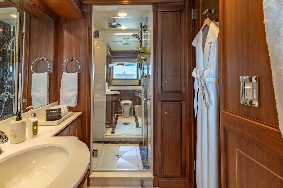 a bathroom with a large mirror aboard BLACKSHEEP Yacht for Charter