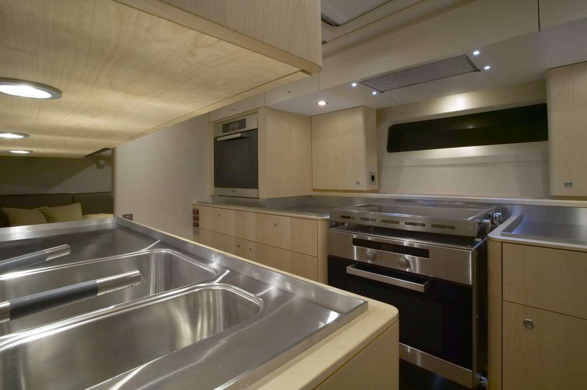 a kitchen with stainless steel appliances aboard BLACK PEARL II Yacht for Charter