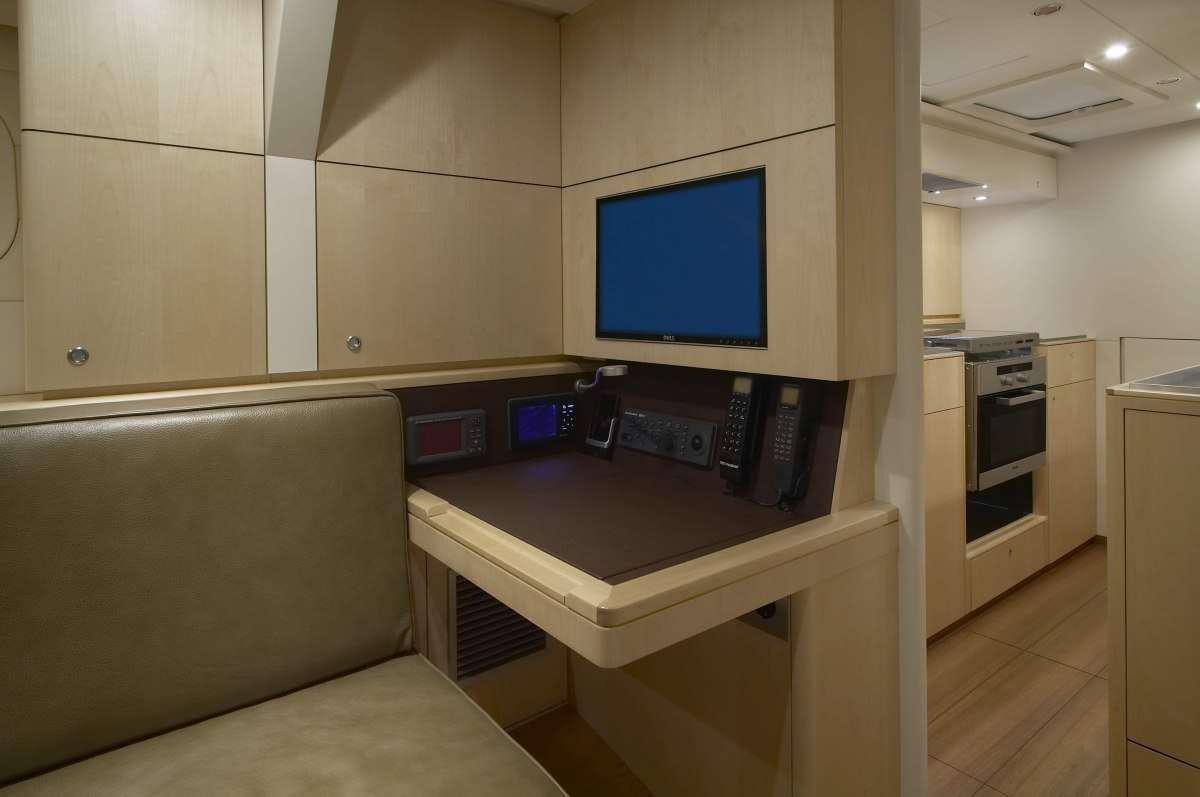 a room with a desk and a computer aboard BLACK PEARL II Yacht for Charter